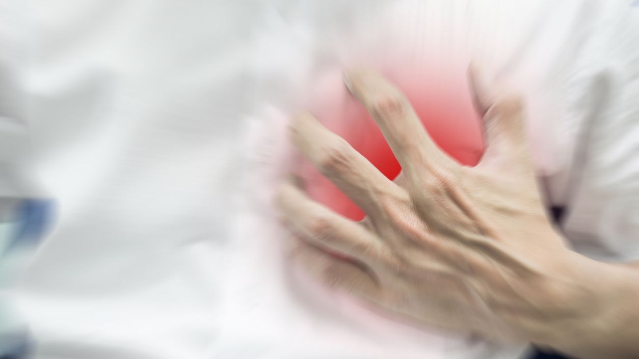 Abstract blur man in white shirt feeling heart attack