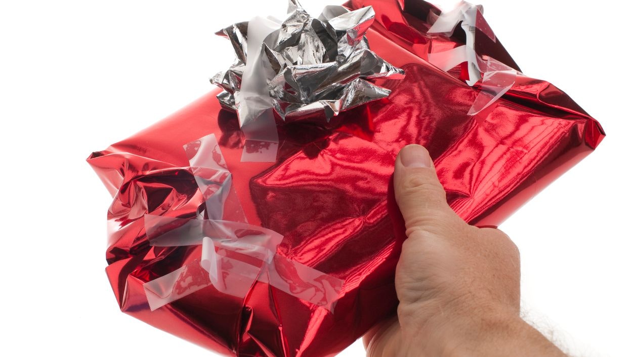"Man gives badly wrapped, messy Christmas present"