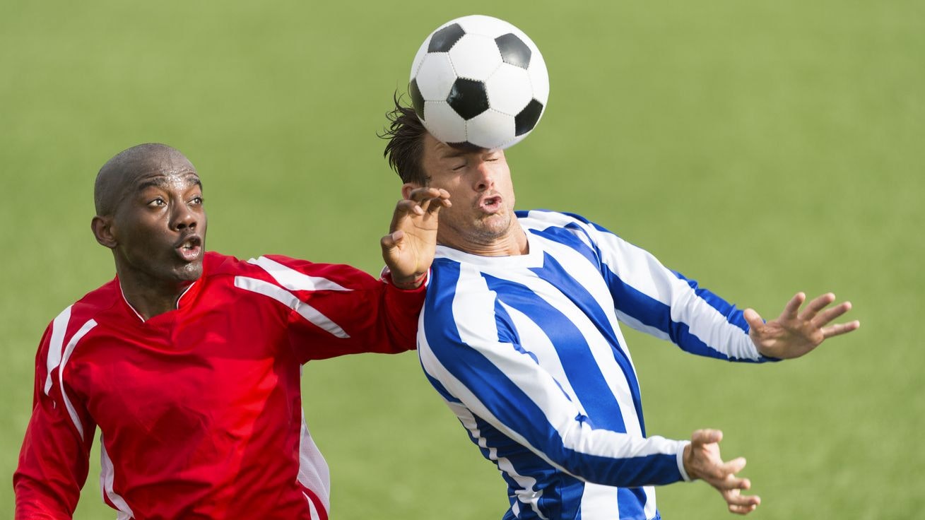 Two footballers in action