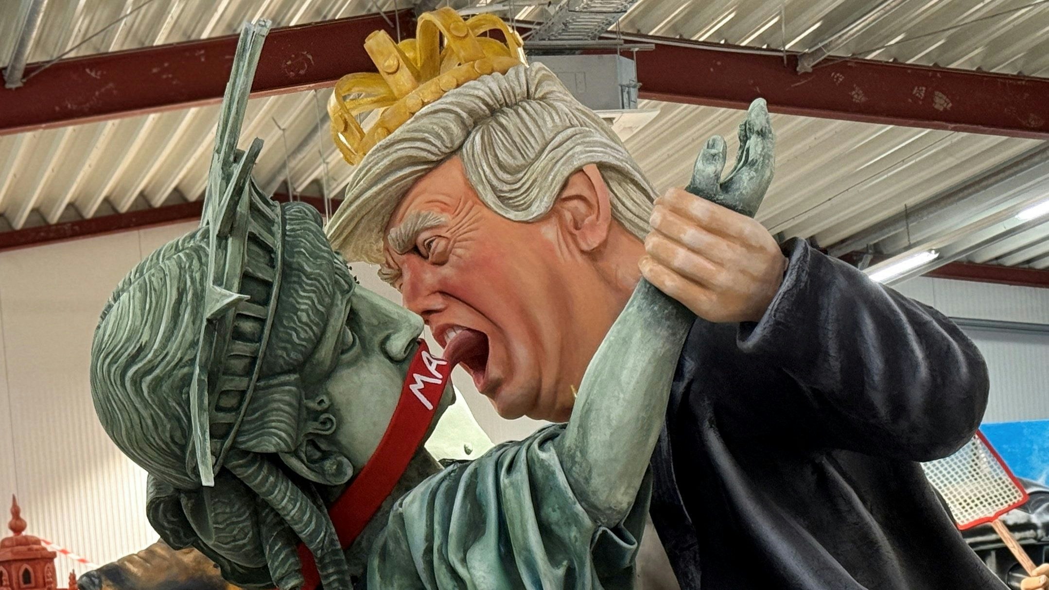 A carnival float depicts U.S. President Donald Trump and the Statue of Liberty with a "MAGA" gag across her mouth during a float preview ahead of the traditional Rose Monday Carnival parade in Mainz, Germany, February 10, 2026.  REUTERS/Timm Reichert