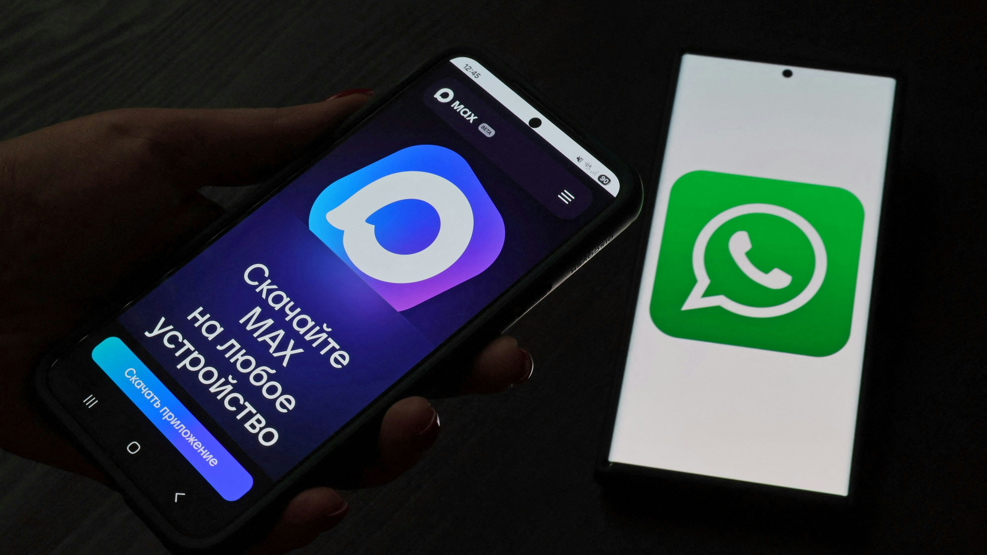 The web page of the Russian MAX messaging app is displayed on a smartphone screen next to the screen displaying the WhatsApp logo, in this illustration taken July 21, 2025. REUTERS/Shamil Zhumatov/Illustration