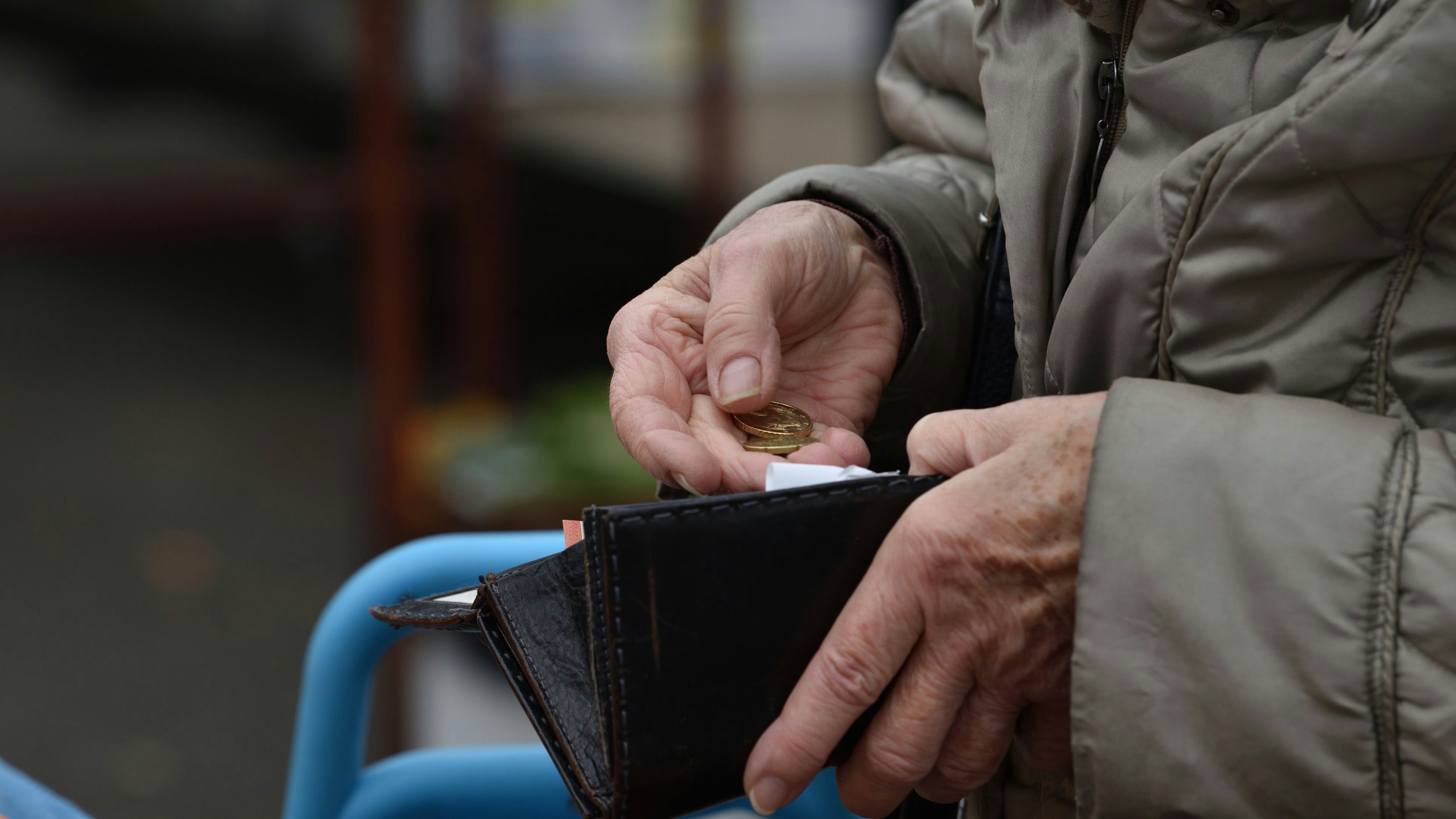 Zagreb, Croatia : 01, 05, 2024 : Close-up of paying  with euros at the vegetable market in Zagreb.