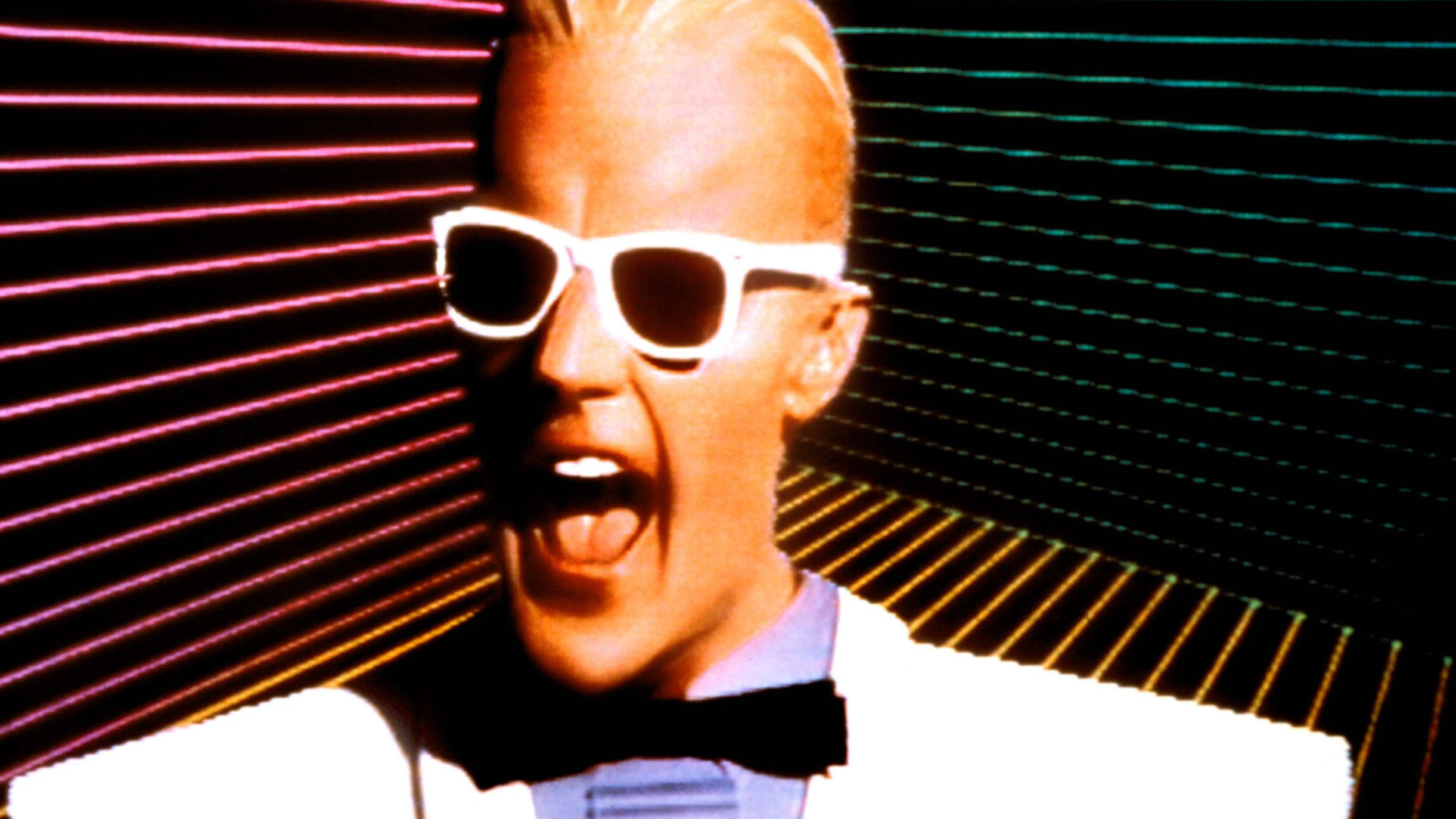 <strong>Max Headroom</strong> – der Mann mit maximaler Stirnfreiheit und minimaler Realität.