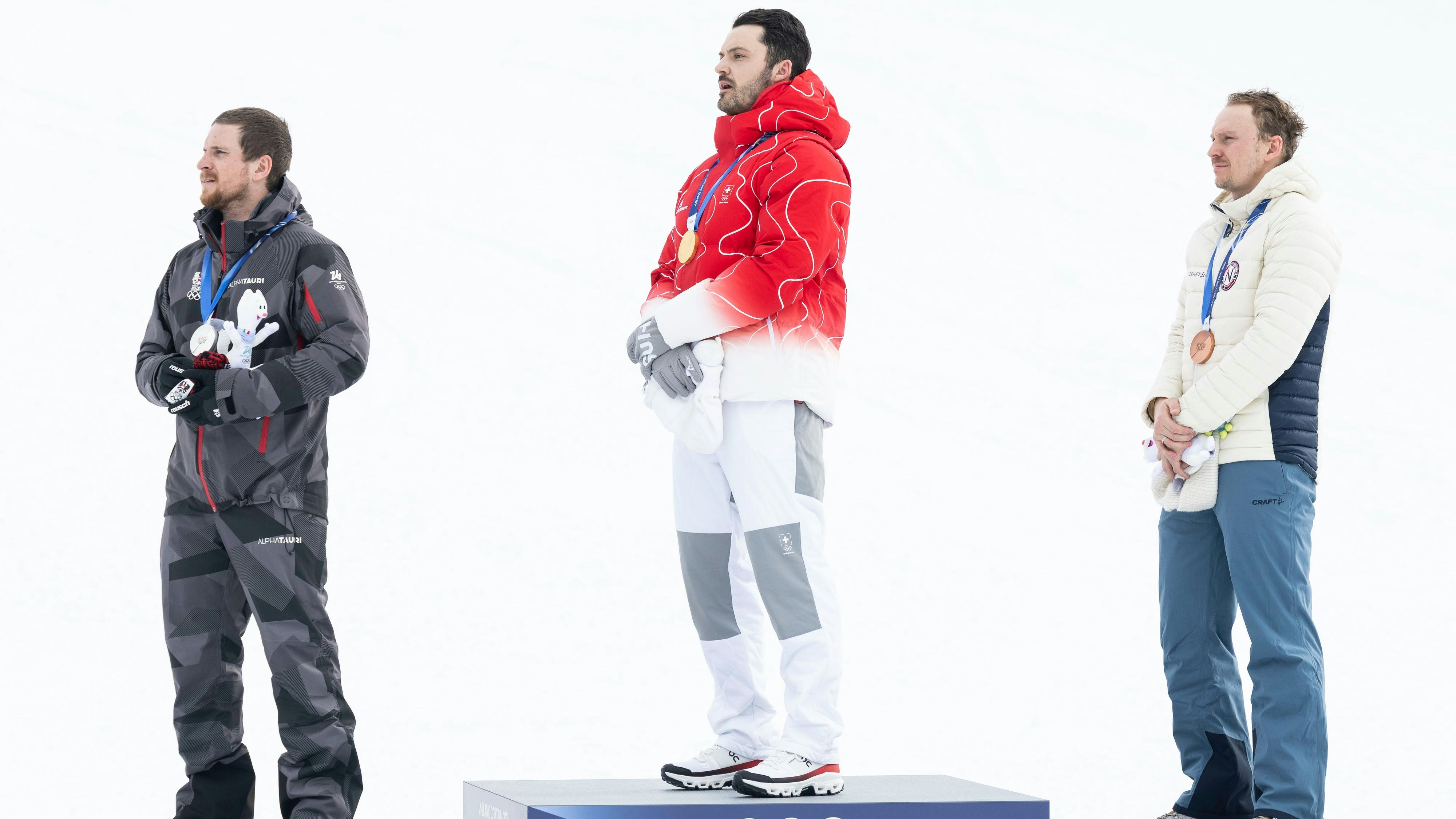 BORMIO,ITALY,16.FEB.26 - OLYMPICS, ALPINE SKIING - Winter Olympic Games Milano Cortina 2026, slalom, men, medal ceremony. Image shows Fabio Gstrein (AUT), Loic Meillard (SUI) and Henrik Kristoffersen (NOR). Photo: GEPA pictures/ Wolfgang Grebien