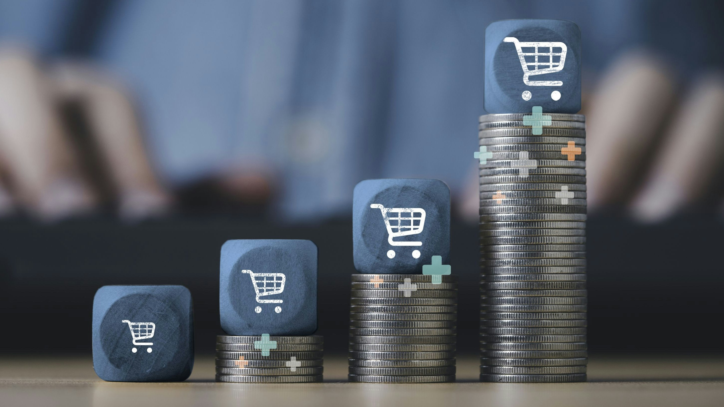 Shopping trolley cart stack on the top of increasing coins stacking for  online sale business growth concept.