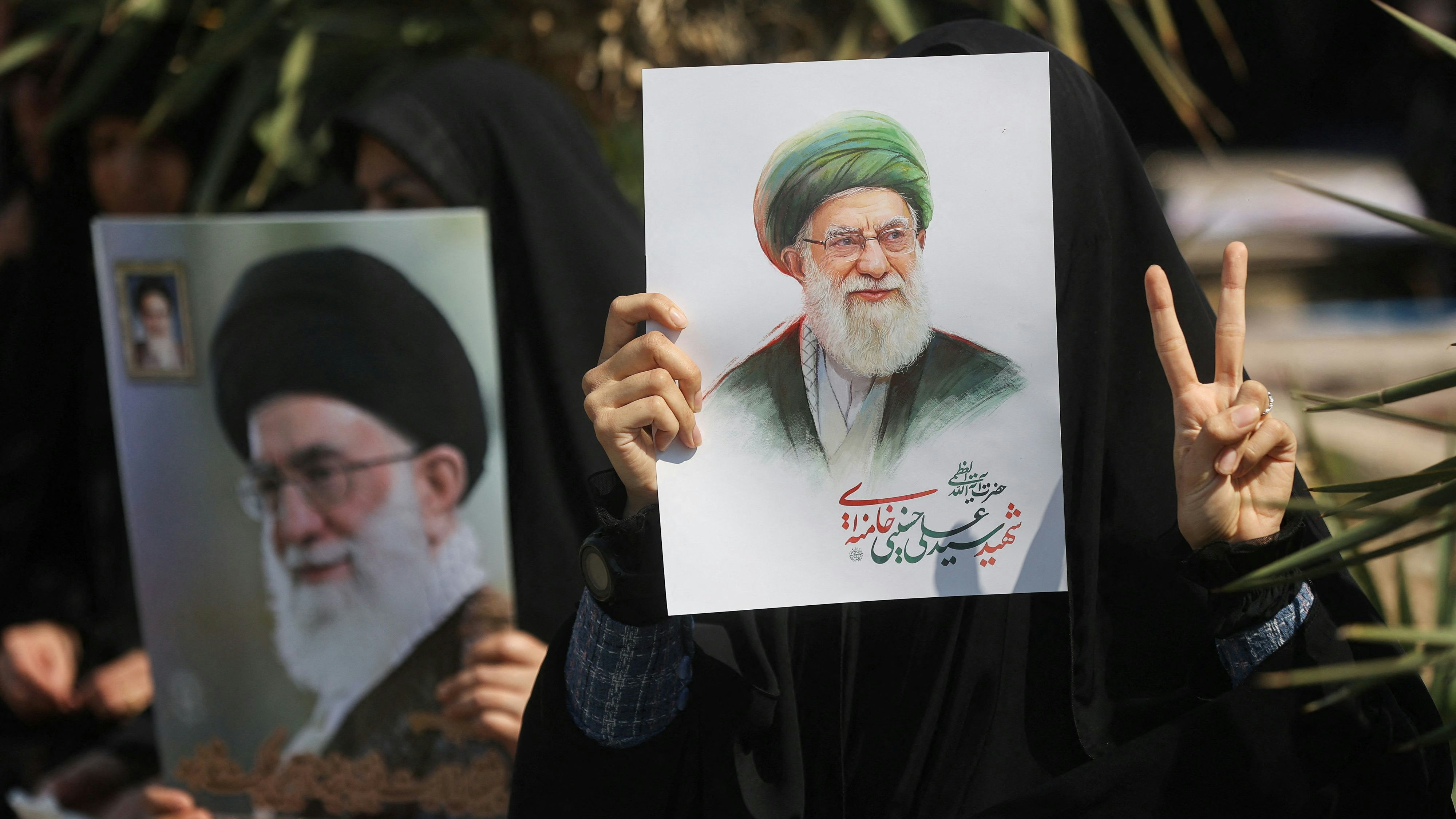 A woman gestures while holding an image of Iran's late Supreme Leader Ayatollah Ali Khamenei, on the day of an anti-Israeli and U.S. rally, amid the U.S.-Israeli conflict with Iran, in Tehran, Iran, March 6, 2026. Majid Asgaripour/WANA (West Asia News Agency) via REUTERS ATTENTION EDITORS - THIS PICTURE WAS PROVIDED BY A THIRD PARTY
