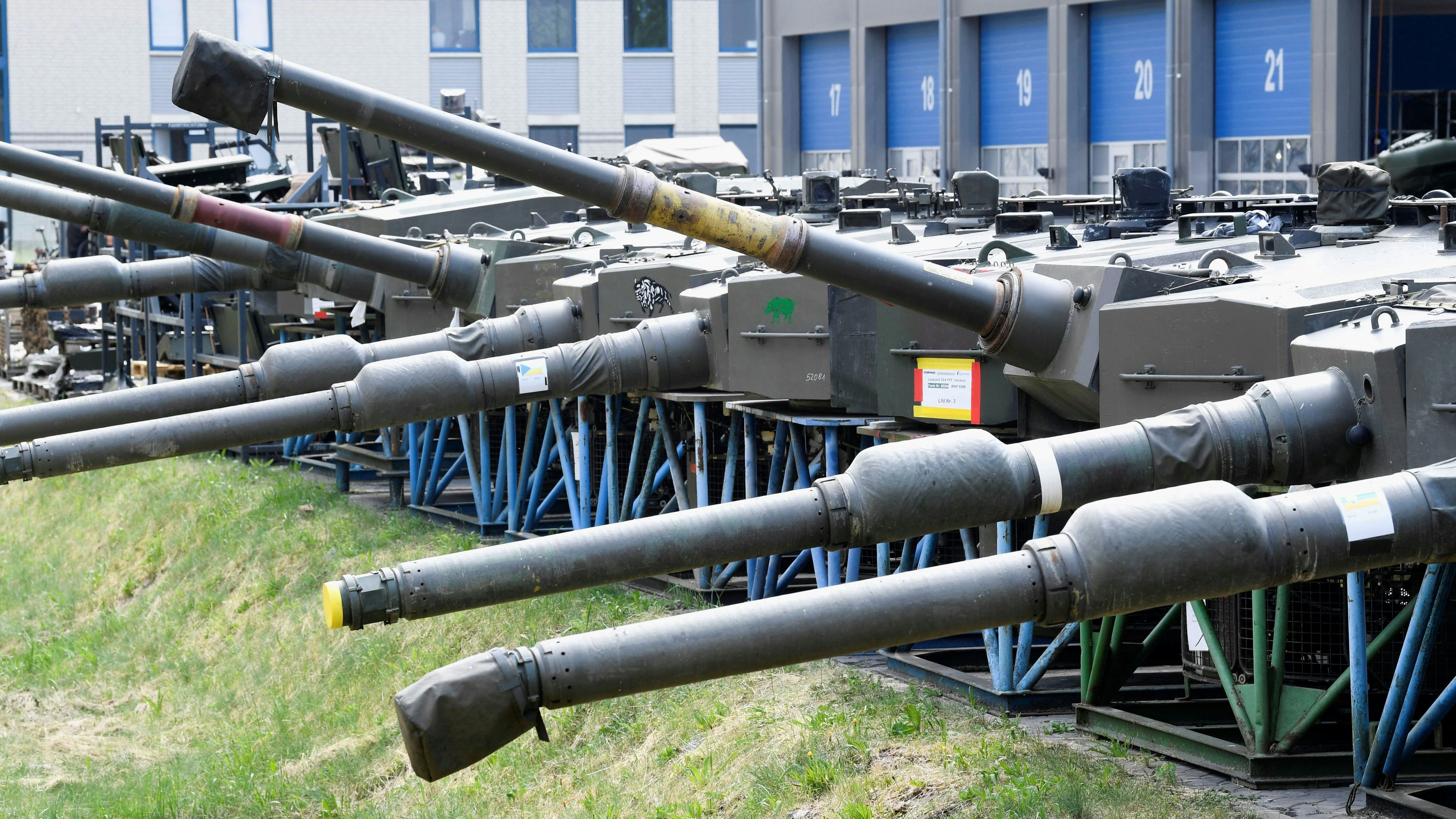 Tank gun barrels and towers for Leopard 2A 4 tanks are pictured beside a production line of German company Rheinmetall, which produces weapons and ammunition for tanks and artillery, during a media tour at the company’s plant in Unterluess, Germany, June 6, 2023. REUTERS/Fabian Bimmer