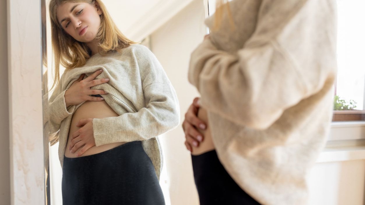 Woman bloating and abdominal pain