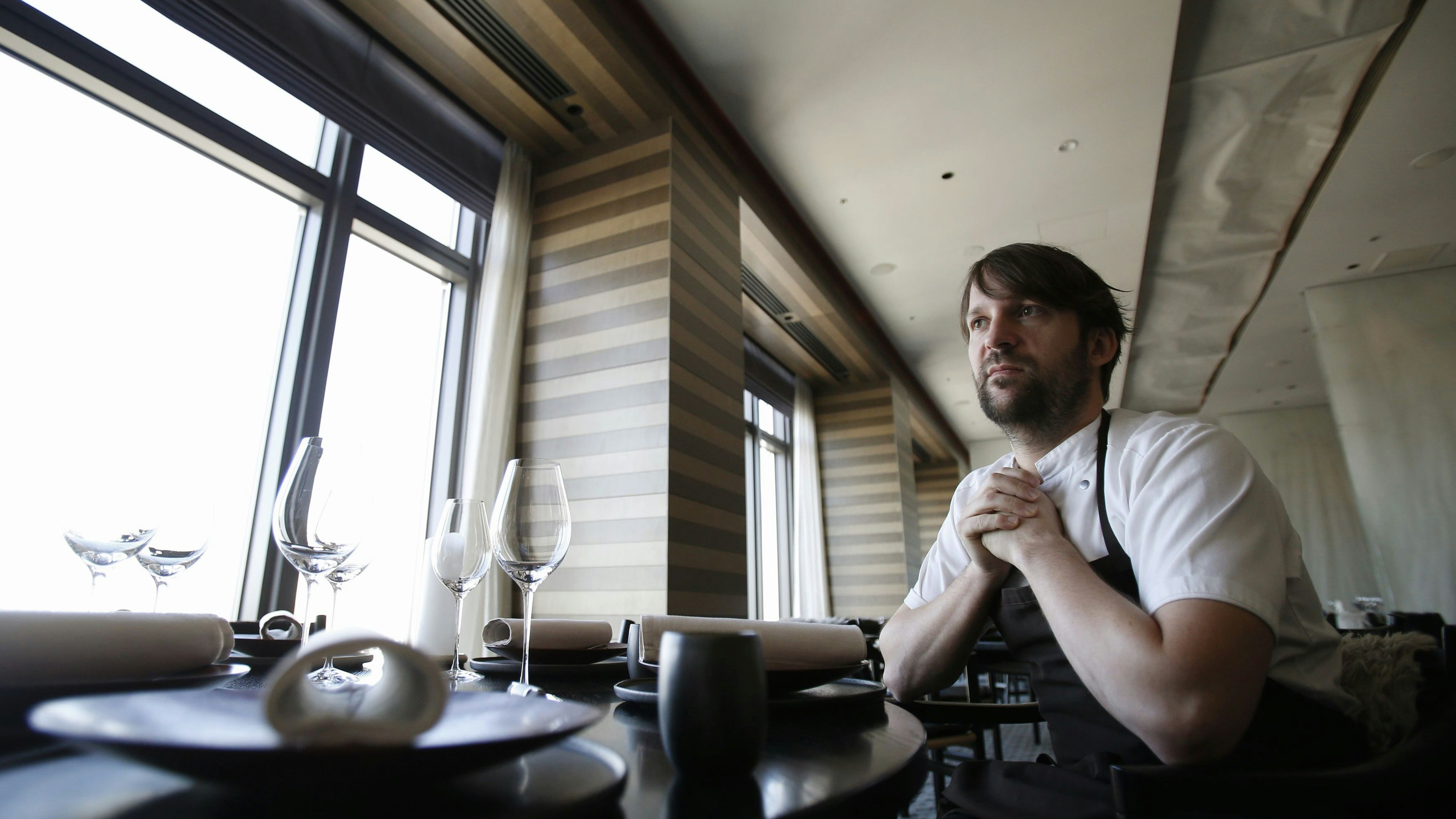 Rene Redzepi, the head chef of Noma in Copenhagen, speaks during an interview with Reuters at Noma at Mandarin Oriental Tokyo February 10, 2015. The world's best restaurant moved to the world's gourmet capital for five weeks and 2,800 diners in Tokyo made good use of it. Redzepi, chef and co-owner of the Danish eatery Noma, temporarily moved the Michelin-starred restaurant and its staff to the 37th floor of a five-star hotel in Japan's capital. Picture taken February 10, 2015. To match FOOD-CHEFS/REDZEPI  REUTERS/Yuya Shino (JAPAN - Tags: FOOD SOCIETY BUSINESS)