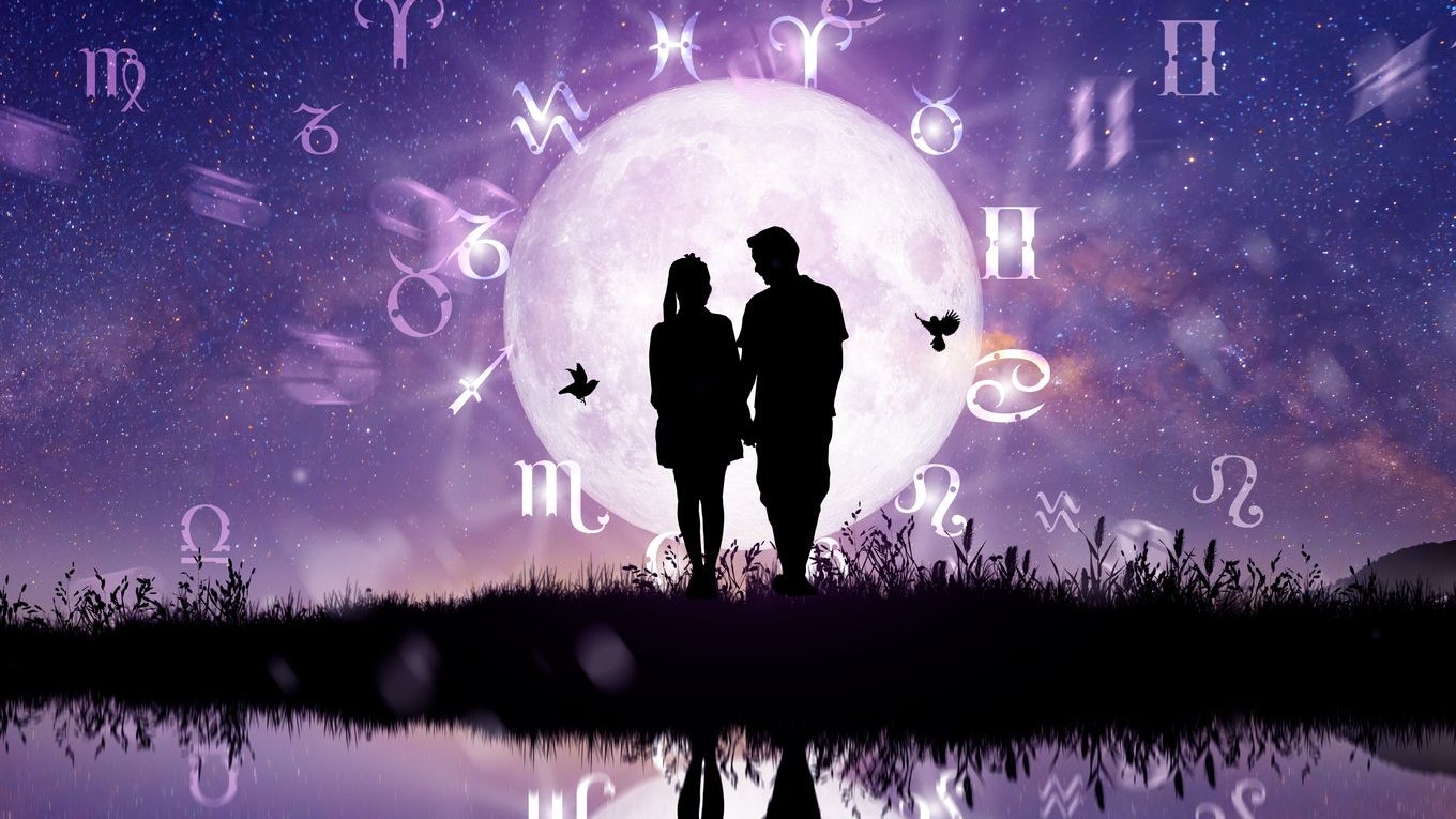 Astrological zodiac signs inside of horoscope circle. Couple singing and dancing over the zodiac wheel and milky way background. The power of the universe concept.