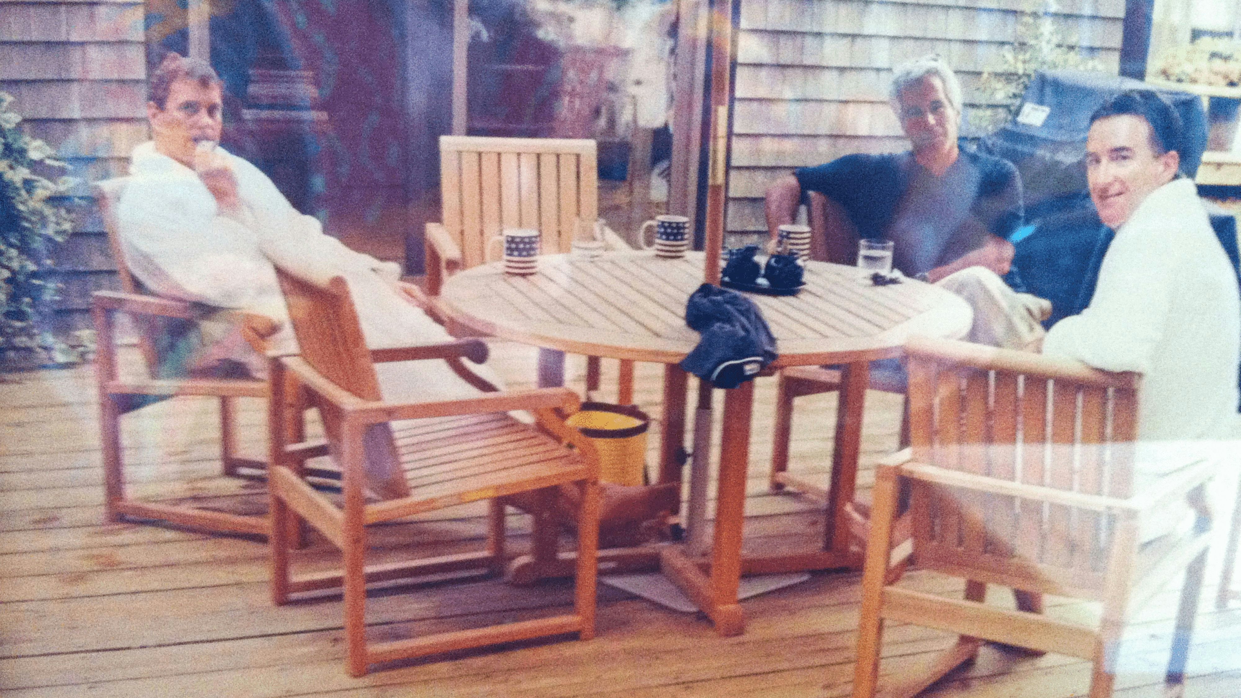 Andrew Mountbatten-Windsor and Lord Peter Mandelson are seen wearing bathrobes seated alongside late financier and convicted sex offender Jeffrey Epstein, in an undated photograph released by the Department of Justice in Washington, D.C., U.S., as part of a trove of documents from its investigations into Epstein. U.S. Justice Department/Handout via REUTERS THIS IMAGE HAS BEEN SUPPLIED BY A THIRD PARTY. 