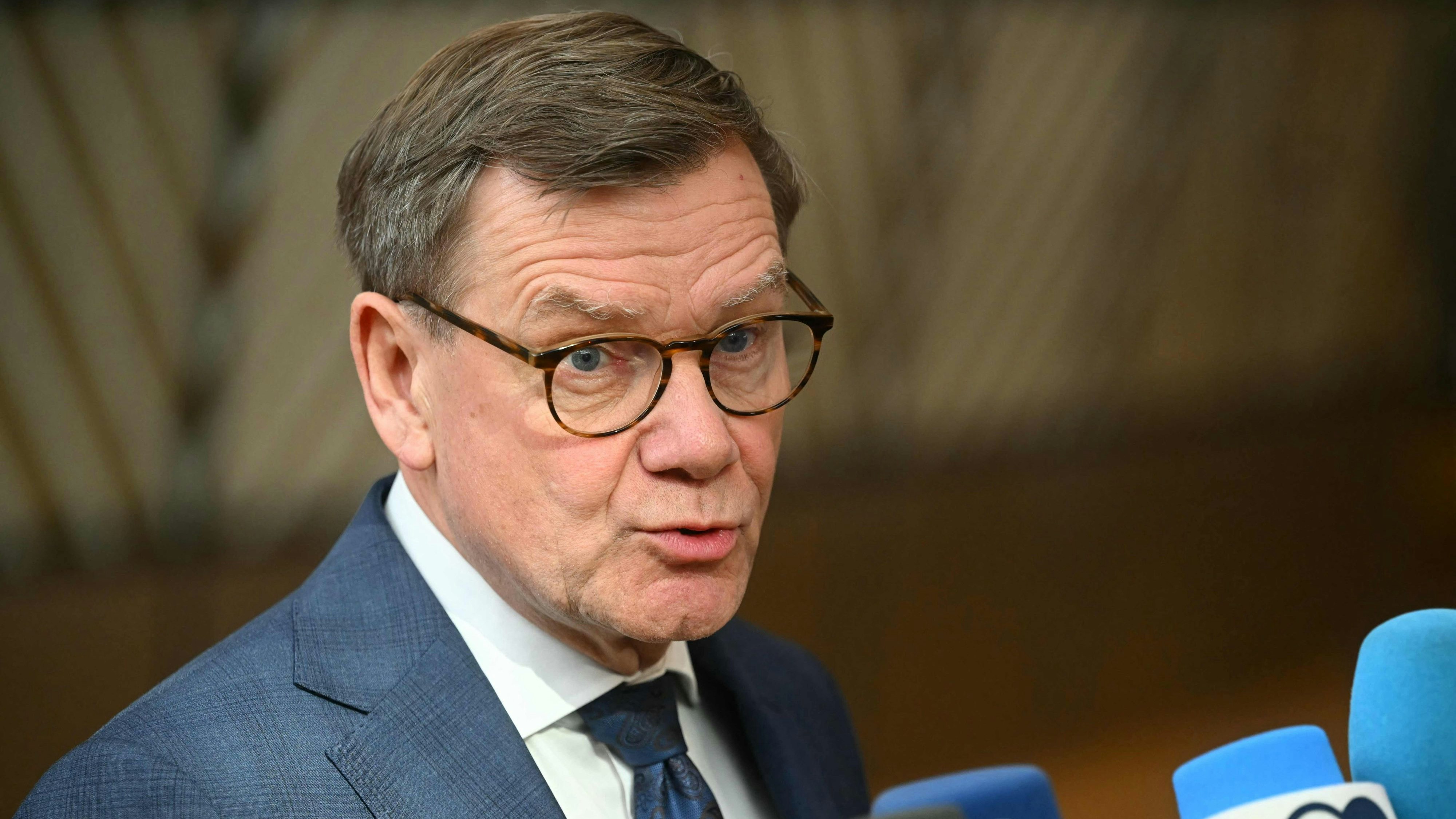 Germany's Foreign Minister Johann Wadephul speaks to the media as he arrives for a Foreign Affairs Council to discuss Russia's war of aggression against Ukraine and the situation in the Middle East, in Brussels on March 16, 2026. (Photo by NICOLAS TUCAT / AFP)