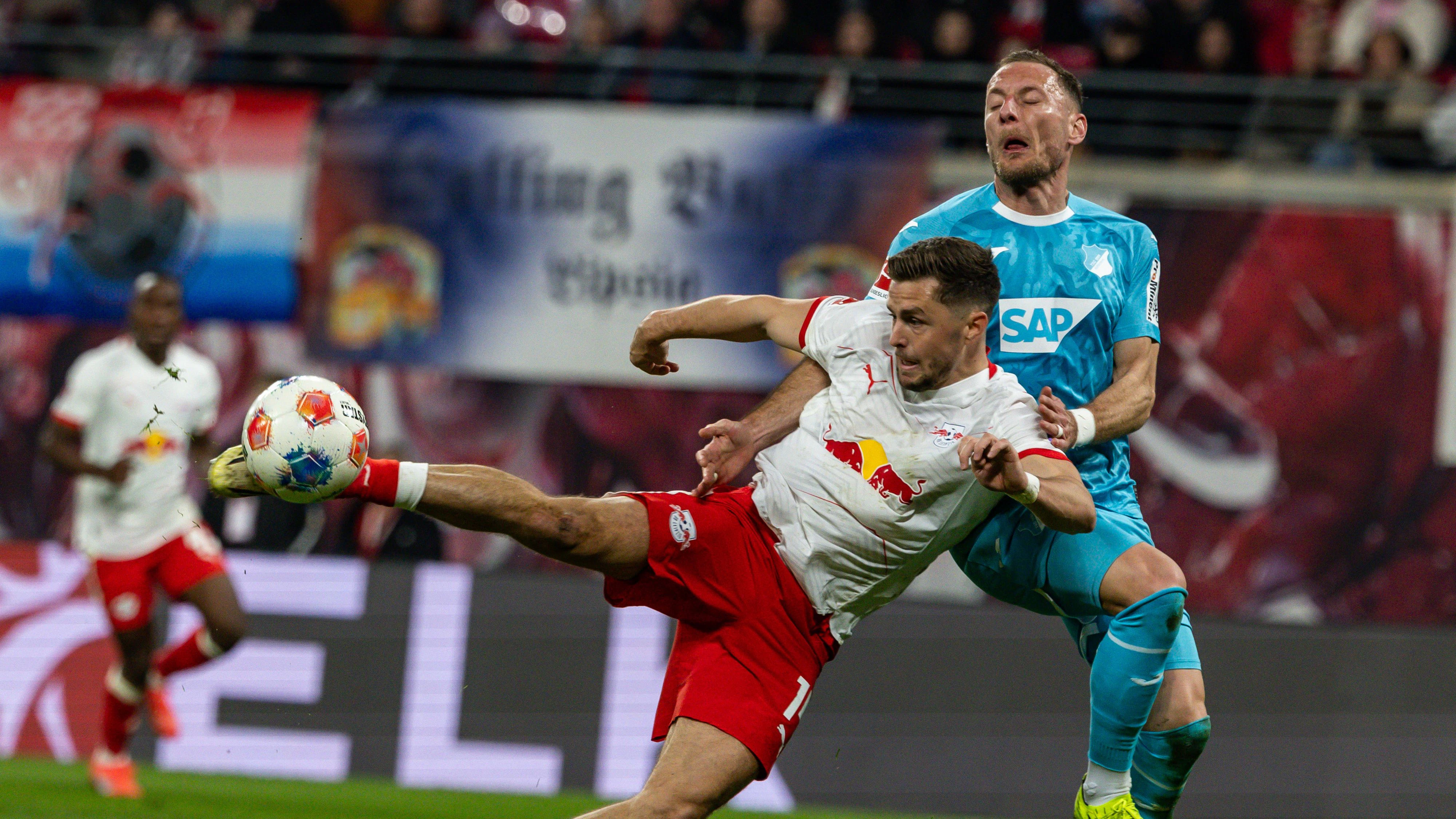 GER, Bundesliga, RB Leipzig - TSG 1899 Hoffenheim. / 20.03.2026, Red Bull Arena, Leipzig, GER, Bundesliga, RB Leipzig - TSG 1899 Hoffenheim. Christoph Baumgartner RB Leipzig 14 mit dem 3:0 gegen Vladimir Coufal / Vladimir Coufal TSG 1899 Hoffenheim 34 Â *** GER, Bundesliga, RB Leipzig TSG 1899 Hoffenheim 20 03 2026, Red Bull Arena, Leipzig, GER, Bundesliga, RB Leipzig TSG 1899 Hoffenheim Christoph Baumgartner RB Leipzig 14 with the 3 0 against Vladimir Coufal Vladimir Coufal TSG 1899 Hoffenheim 34 Â nordphotoxGmbHxx/xAlexanderxTrienitz nph00051