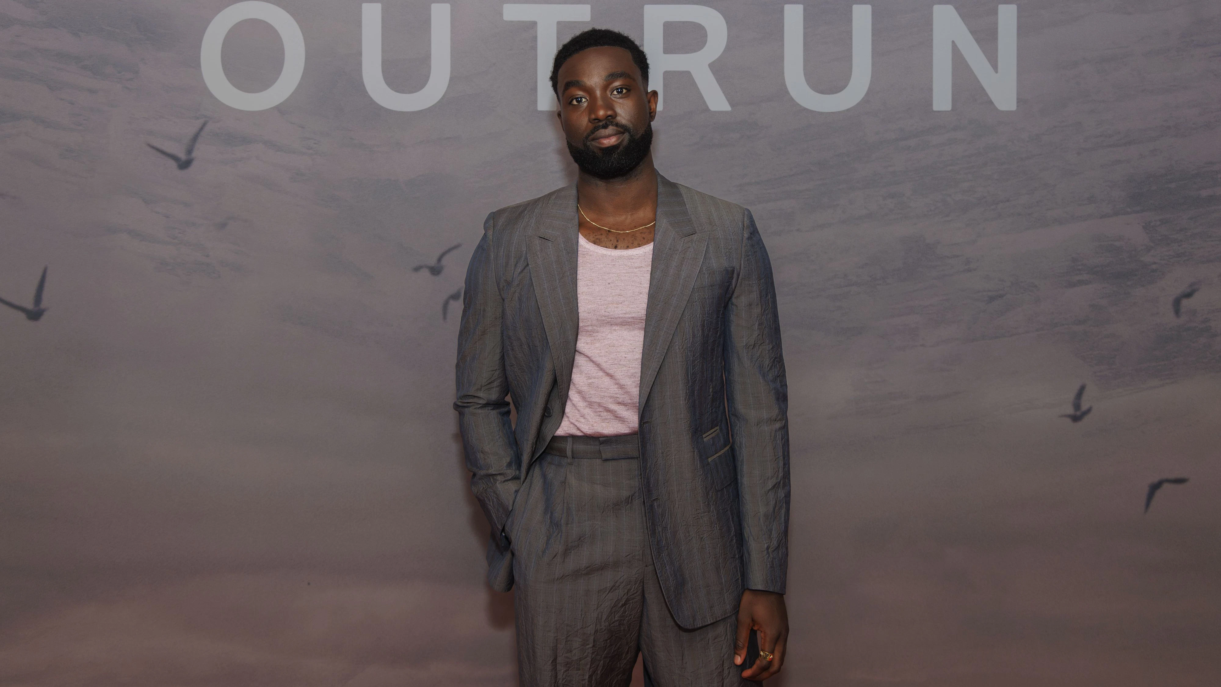 Paapa Essiedu poses for photographers upon arrival for the screening of the film 'The Outburn' on Wednesday, Sept. 18, 2024 in London. (Photo by Vianney Le Caer/Invision/AP)