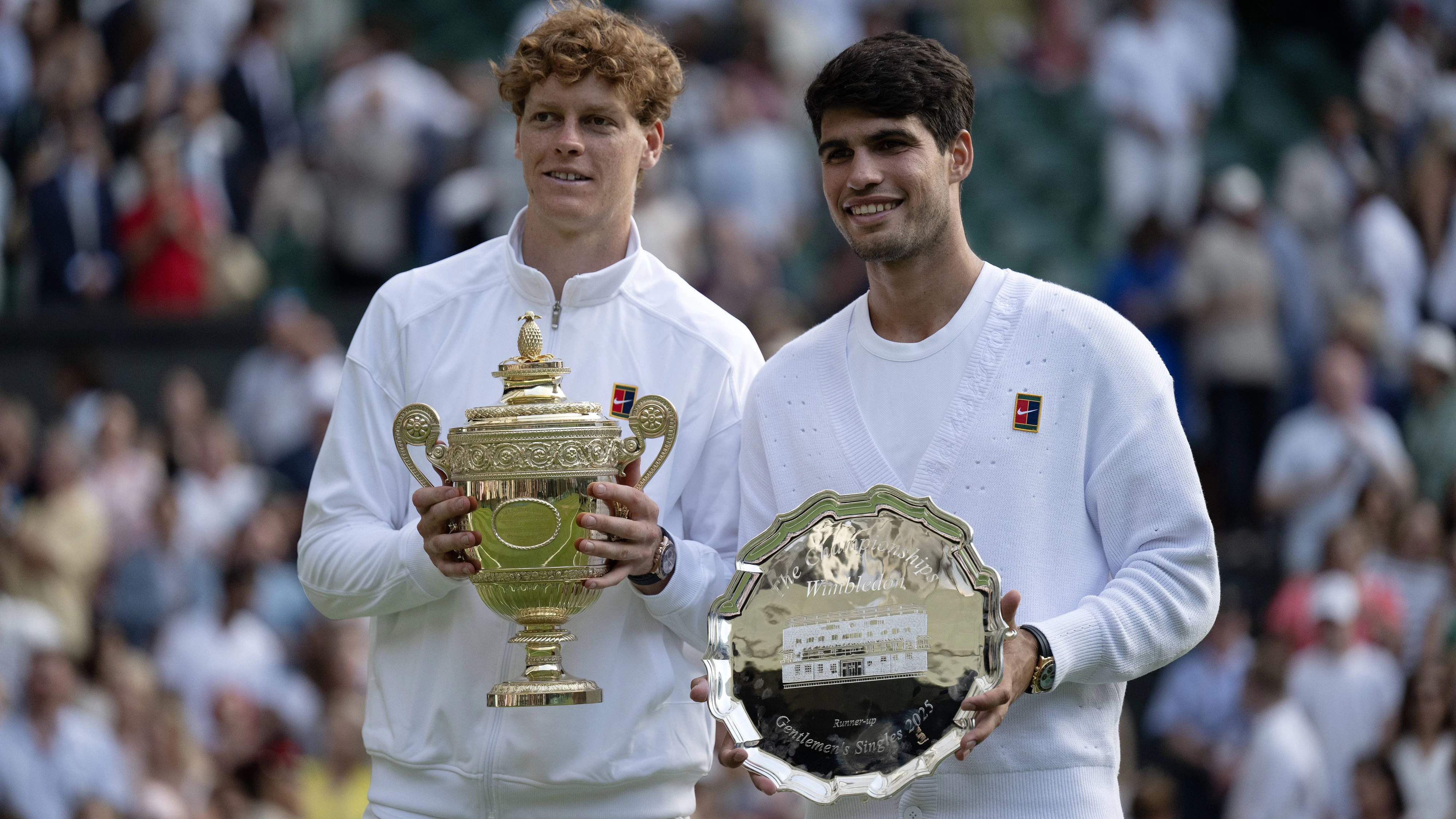 Day Fourteen: The Championships - Wimbledon 2025 LONDON, ENGLAND - JULY 13: Jannik Sinner of Italy and Carlos Alcaraz of Spain pose for a photo after being presented with the Gentlemen s Singles trophies following the Gentlemens Singles Final on day fourteen of The Championships Wimbledon 2025 at All England Lawn Tennis and Croquet Club on July 13, 2025 in London, England. Photo by Visionhaus via  London All England Lawn Tennis and Croq England United Kingdom Copyright: xVisionhausx 776305105