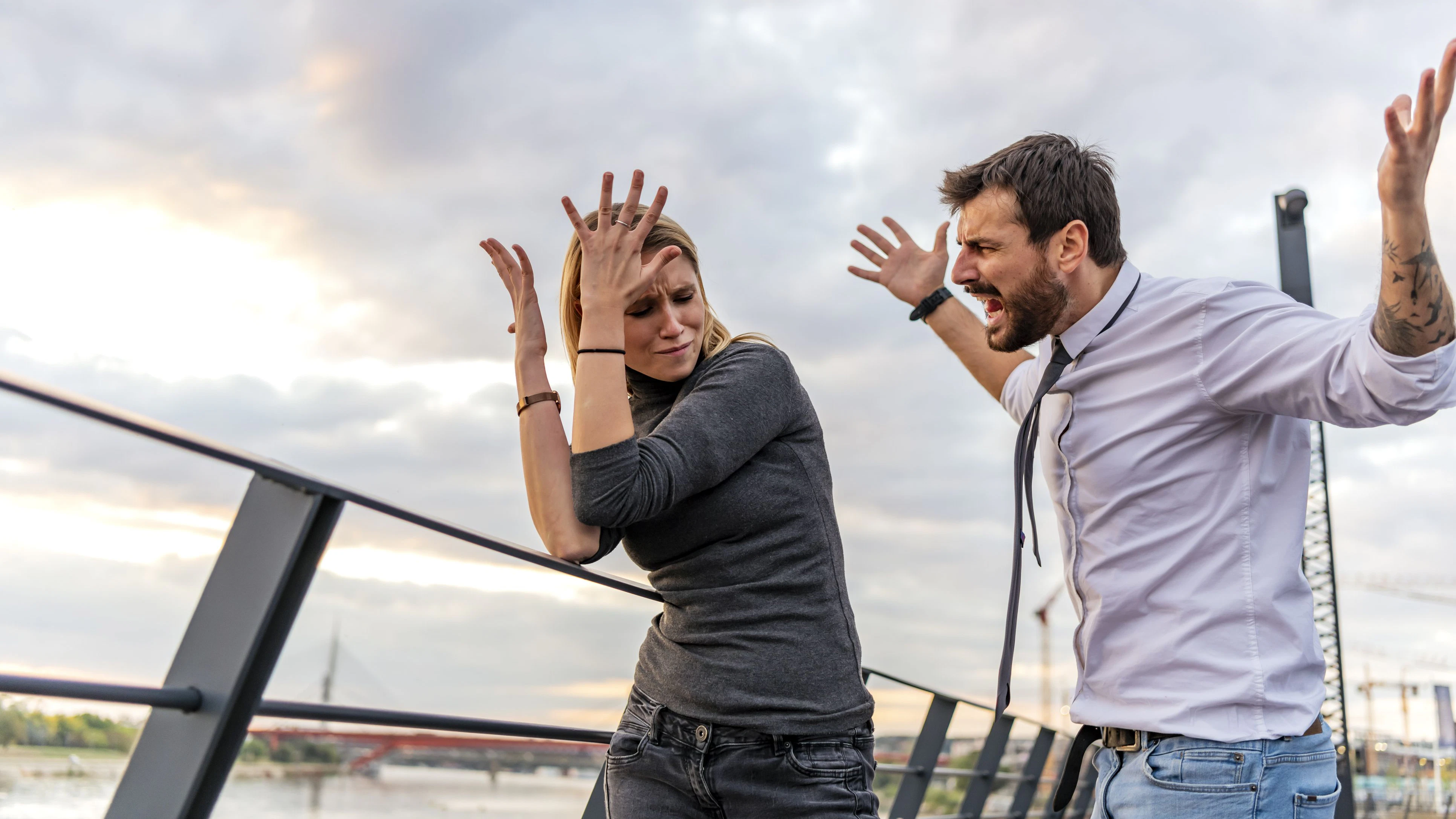 Beautiful Young Couple is Have a Serious Debate During a Walk Near the River During a Sunset. They are Arguing with each Other and Having a Hard Conversation.