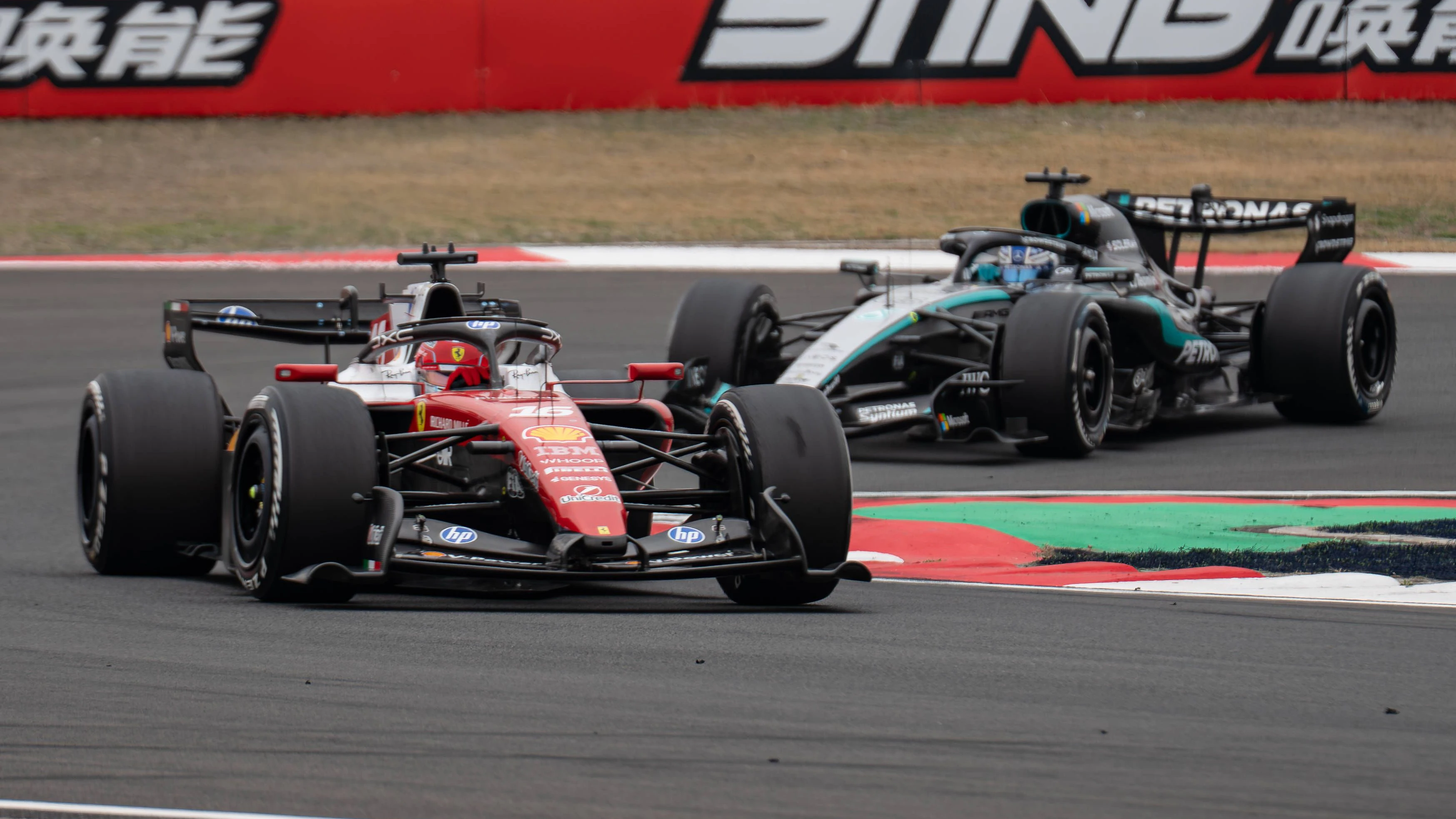 F1 Grand Prix Of China Scuderia Ferrari driver Charles Leclerc and Mercedes-AMG Petronas F1 Team driver George Russell compete for position during the race at the 2026 Formula 1 Chinese Grand Prix, round 2 of the FIA Formula 1 World Championship, WM, Weltmeisterschaft at Shanghai International Circuit in Shanghai, China, on March 15, 2026. Shanghai Shanghai China PUBLICATIONxNOTxINxFRA Copyright: xWanxMikhailxRoslanx originalFilename:roslan-formula1260315_npP8B.jpg