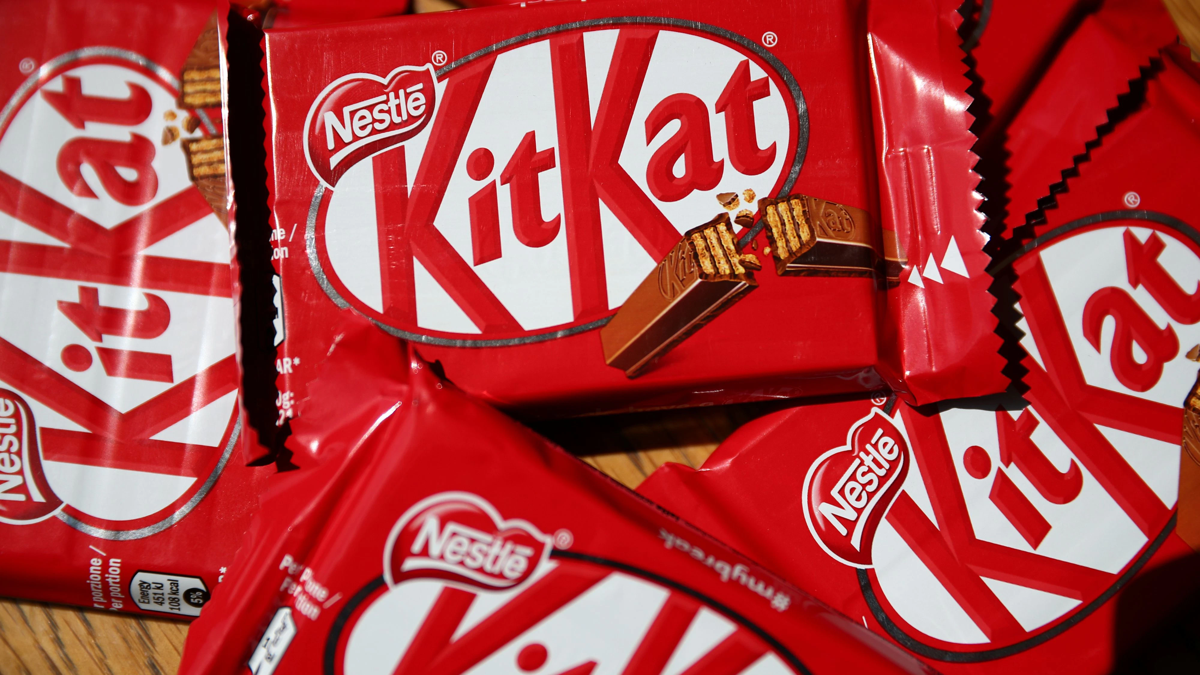 Packets of Kit Kat chocolate covered wafer bars manufactured by Nestle are seen in London, Britain, July 25, 2018. REUTERS/Hannah McKay/Photo Illustration
