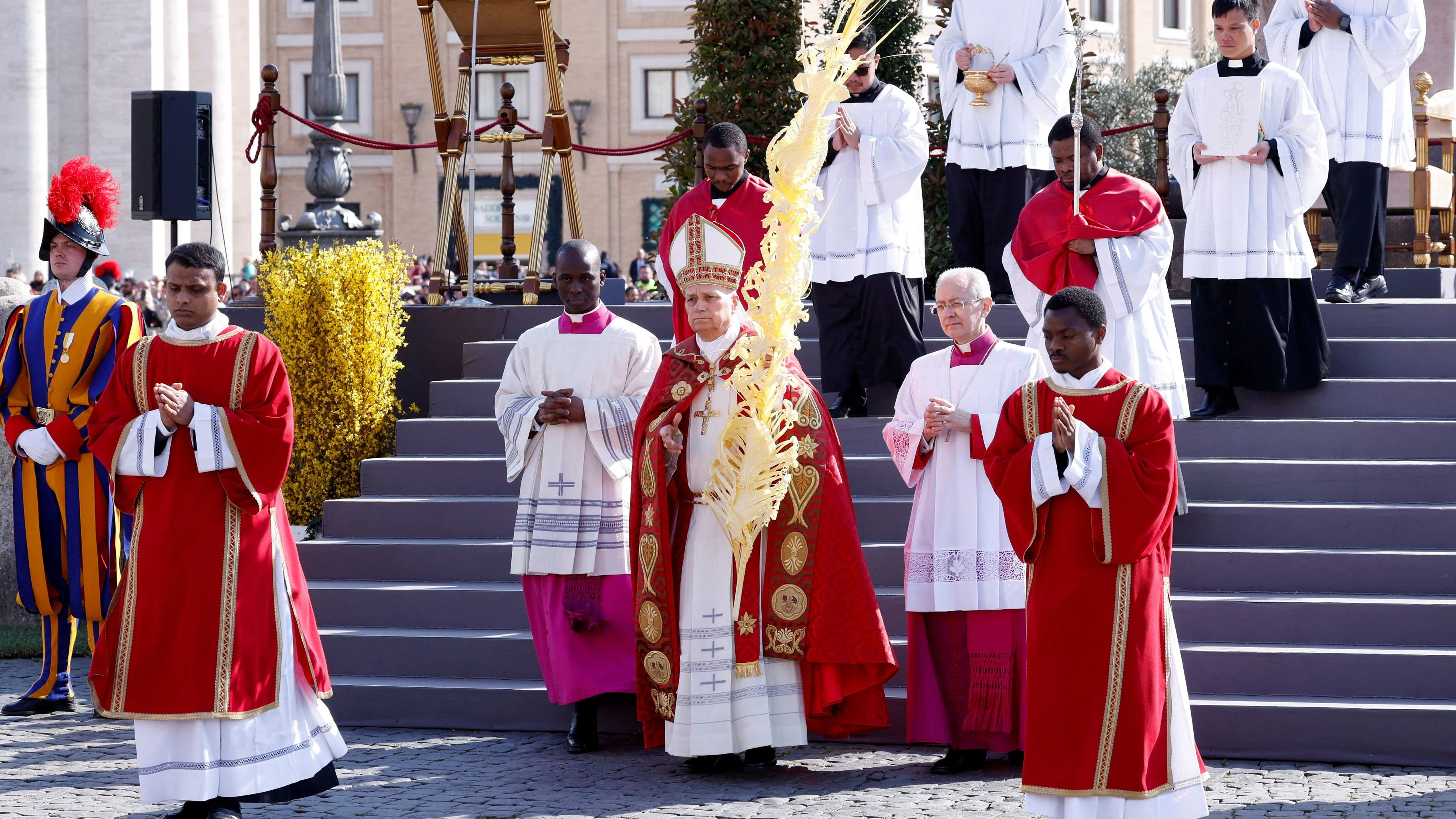 Pope Leo XIV walks holding a palm branch as he celebrates the Palm Sunday Mass in Saint Peter's Square at the Vatican, March 29, 2026. REUTERS/Remo Casilli/Pool     TPX IMAGES OF THE DAY     