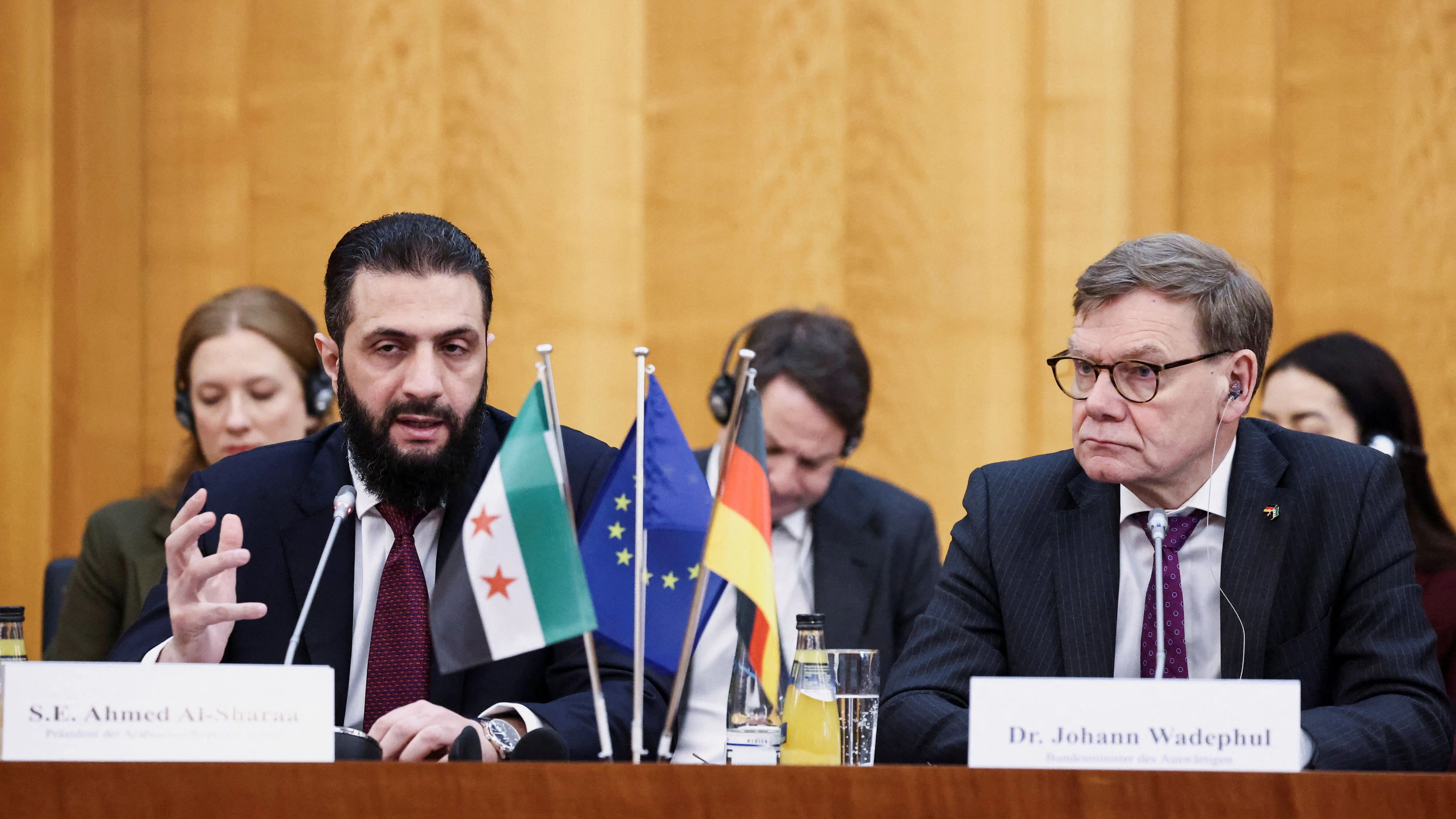 German Foreign Minister Johann Wadephul and Syrian President Ahmed al-Sharaa attend a roundtable meeting in Berlin, Germany March 30, 2026. REUTERS/Nadja Wohlleben