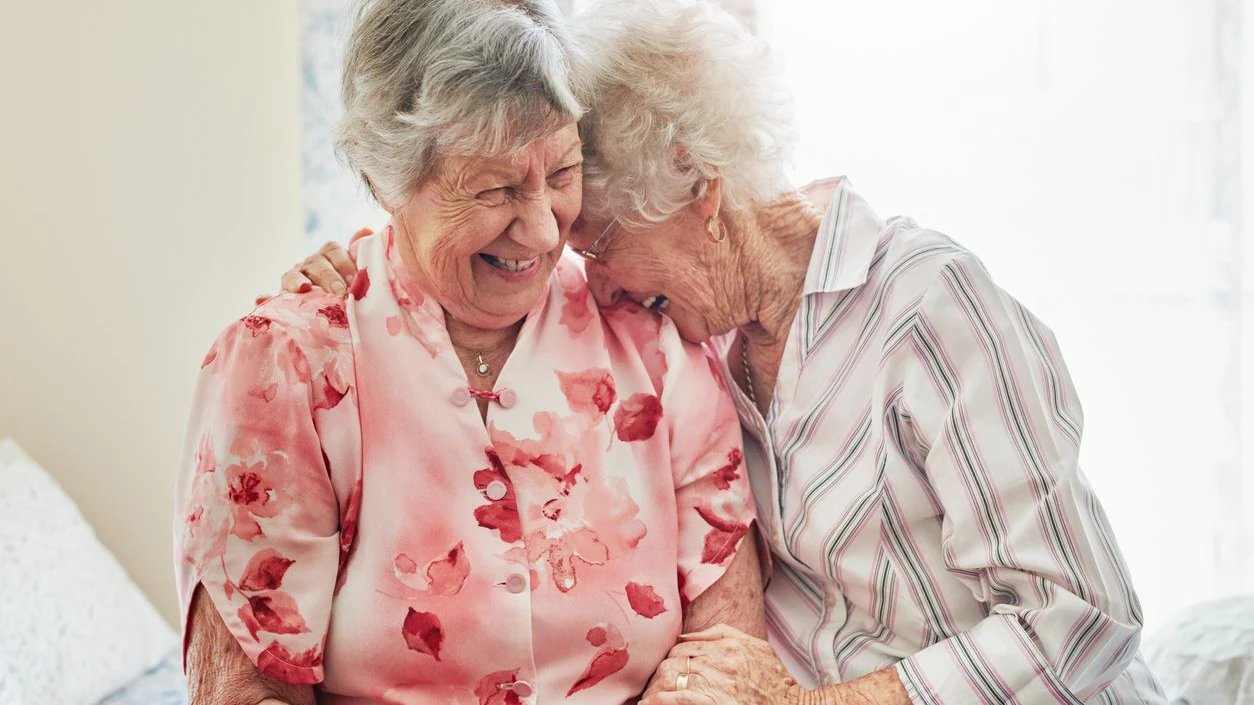 Shot of two happy elderly women spending time with each other at home