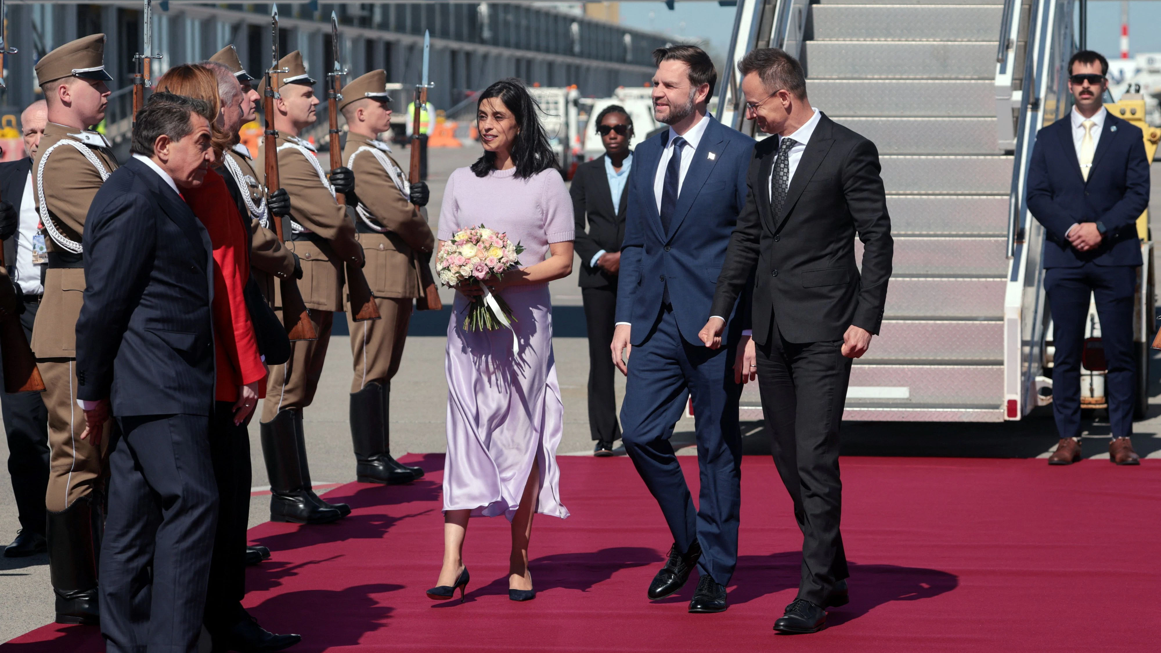 Hungarian Foreign Minister Peter Szijjarto welcomes U.S. Vice President JD Vance and second lady Usha Vance as they arrive at Budapest Ferenc Liszt International Airport in Budapest, Hungary, April 7, 2026. REUTERS/Jonathan Ernst/Pool