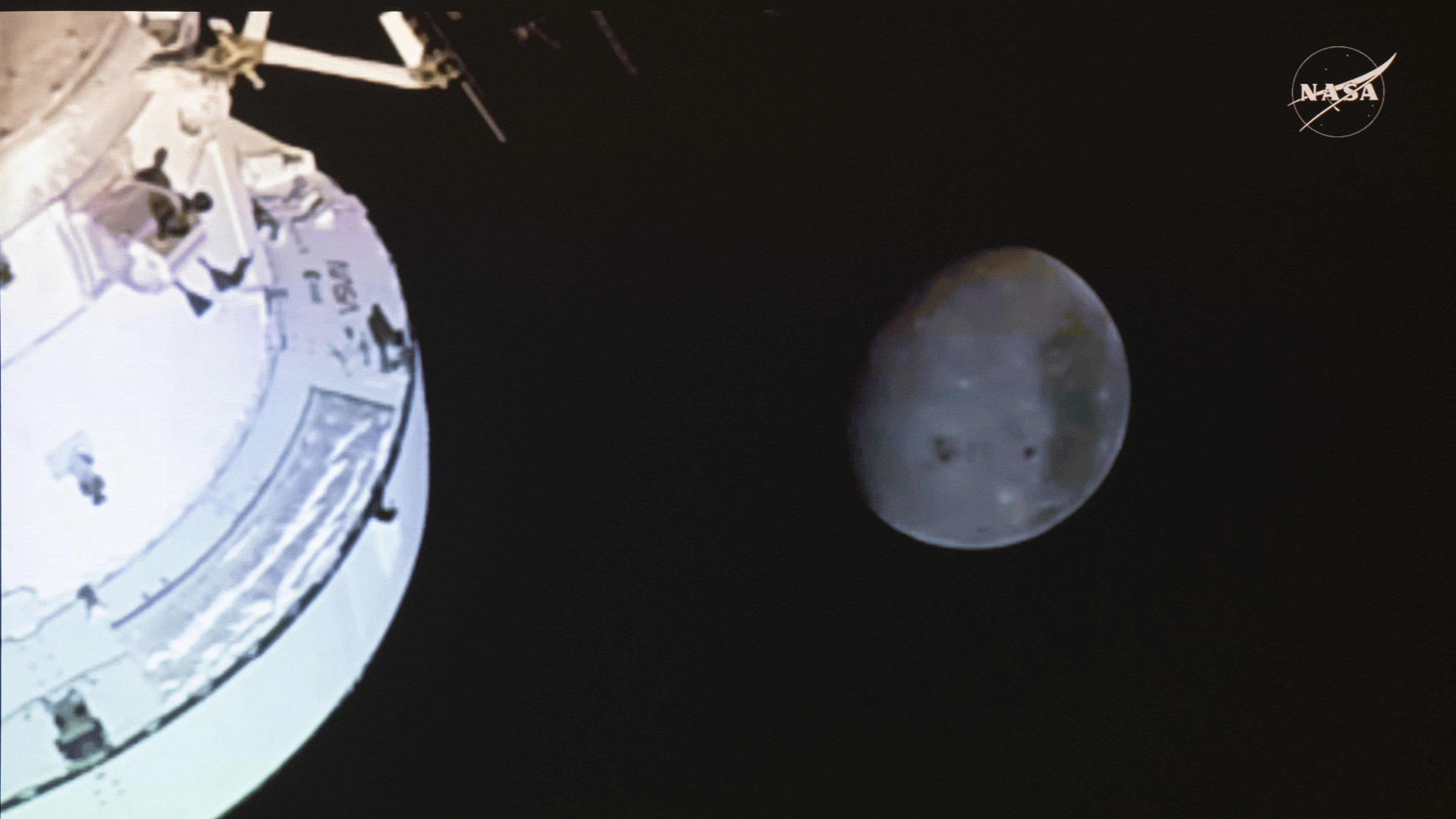 The moon is seen from Artemis II mission as astronauts including Canadian Jeremy Hansen make a record-breaking lunar flyby on a live feed at the Canadian Space Agency headquarters in Longueuil, Que., on Monday, April 6, 2026. THE CANADIAN PRESS/Christinne Muschi