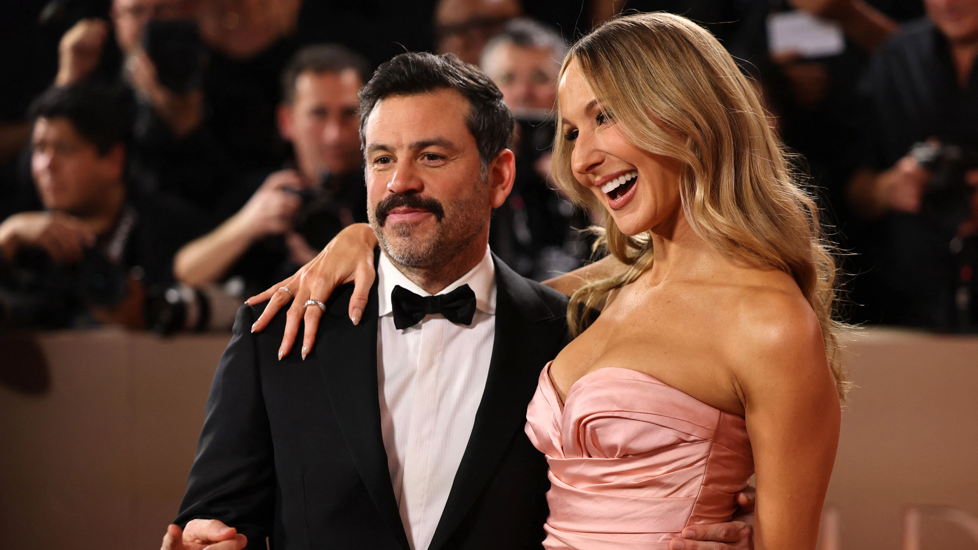 Nikki Glaser and Chris Convy pose on the red carpet at the 83rd Annual Golden Globes in Beverly Hills, California, U.S., January 11, 2026. REUTERS/Daniel Cole
