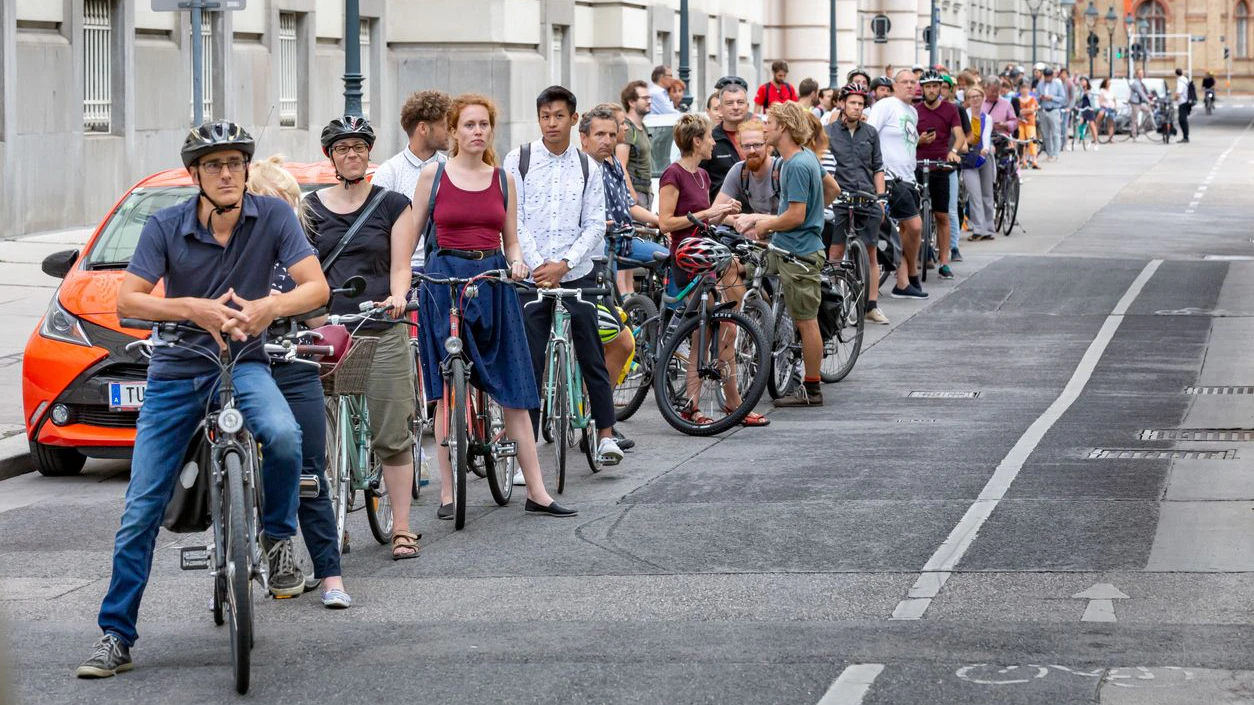 Vienna, Austria – August 13, 2019: row of cyclists waiting during a cycling flash mob in Vienna, Austria
