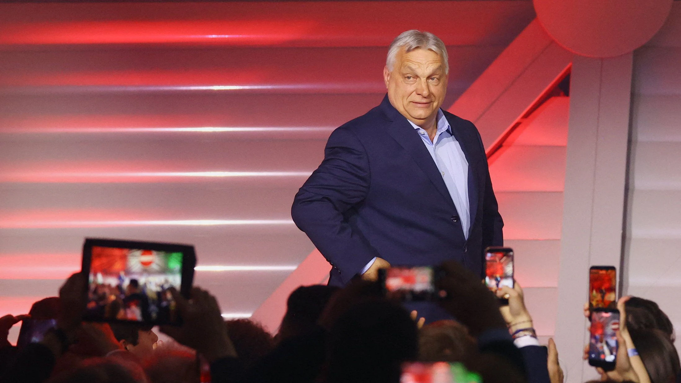 Hungarian Prime Minister Viktor Orban arrives to address supporters after the announcement of the partial results of parliamentary election in Budapest, Hungary, April 12, 2026. REUTERS/Bernadett Szabo