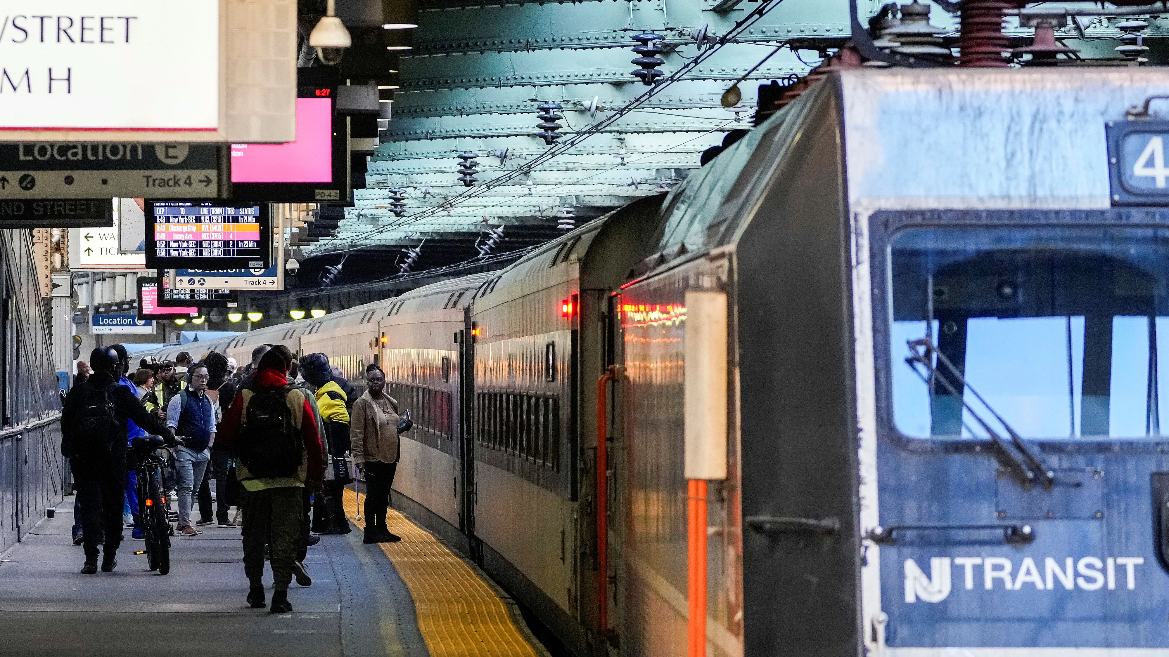 People wait to board a NJ Transit train at Newark-Penn Station, in Newark, New Jersey, U.S., May 20, 2025.  REUTERS/Eduardo Munoz