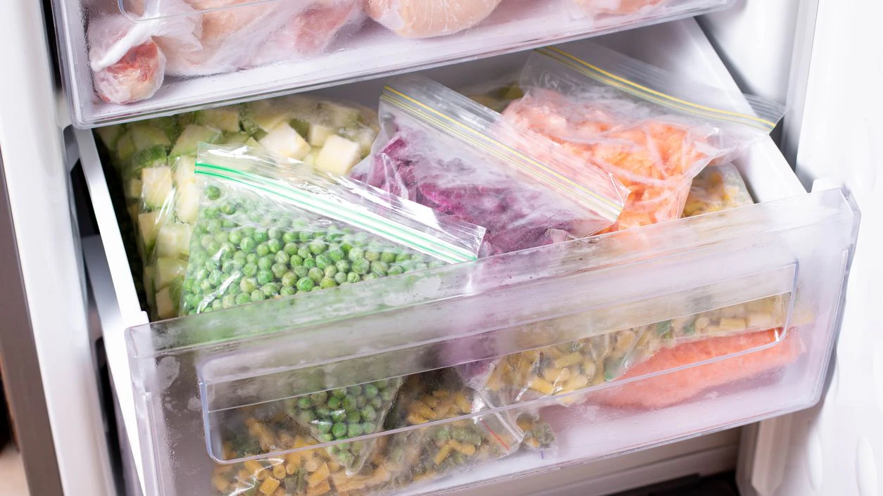 Assortment of frozen Vegetables in home fridge. Frozen food in the freezer