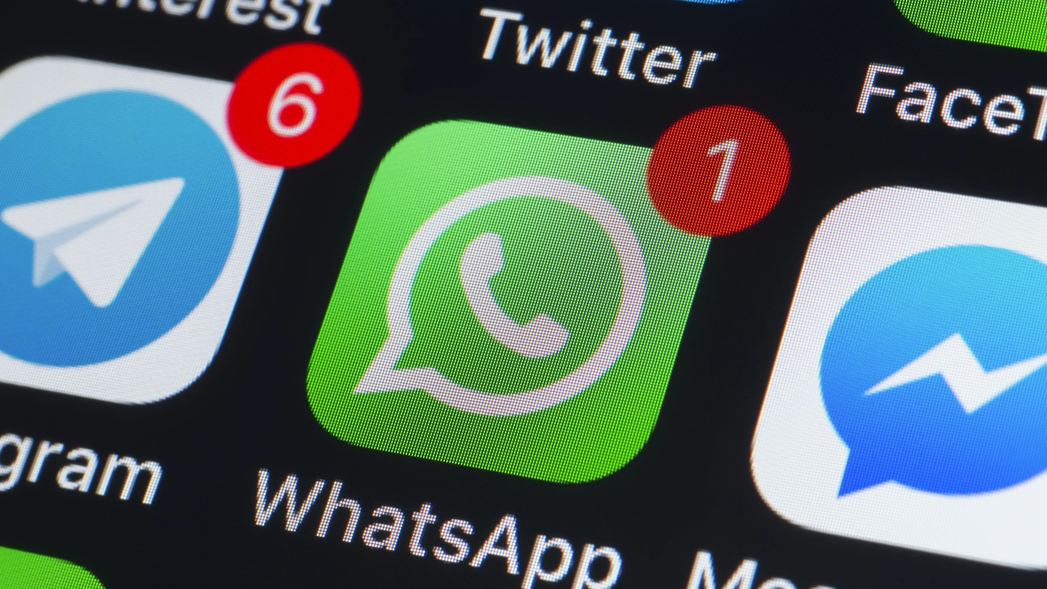 London, UK - July 19, 2018: The buttons of Whatsapp, Messenger, Telegram, Pinterest Twitter, Facetime and other chat apps on the screen of an iPhone.