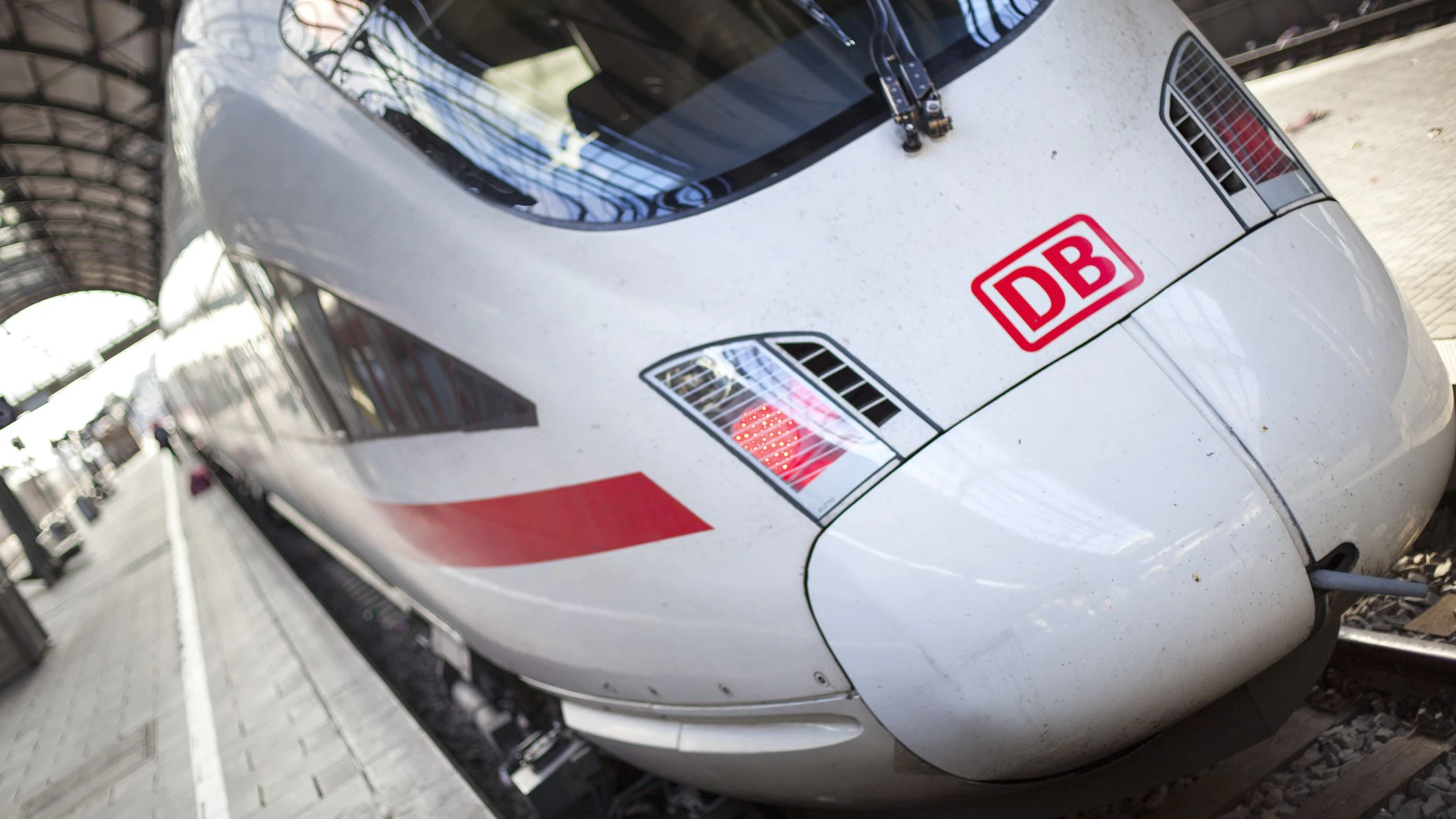 An ICE train waiting for its departure at main station Wiesbaden, Germany. ICE, formerly known as InterCityExpress is a highspeed train system in Germany. The pictured train connects the cities Wiesbaden in the west and Leipzig in the East of Germany. Deutsche Bahn AG (DB) is a national railway company in Germany and headquartered in Berlin. DB is the successor to the former state railways of Germany (Deutsche Bundesbahn)