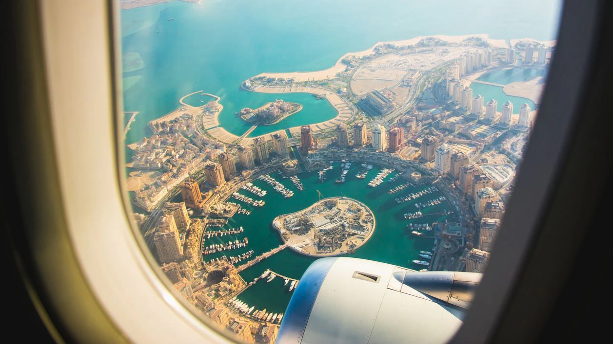 Aerial view of the Pearl-Qatar island in Doha through the airplane porthole. Qatar, the Persian Gulf