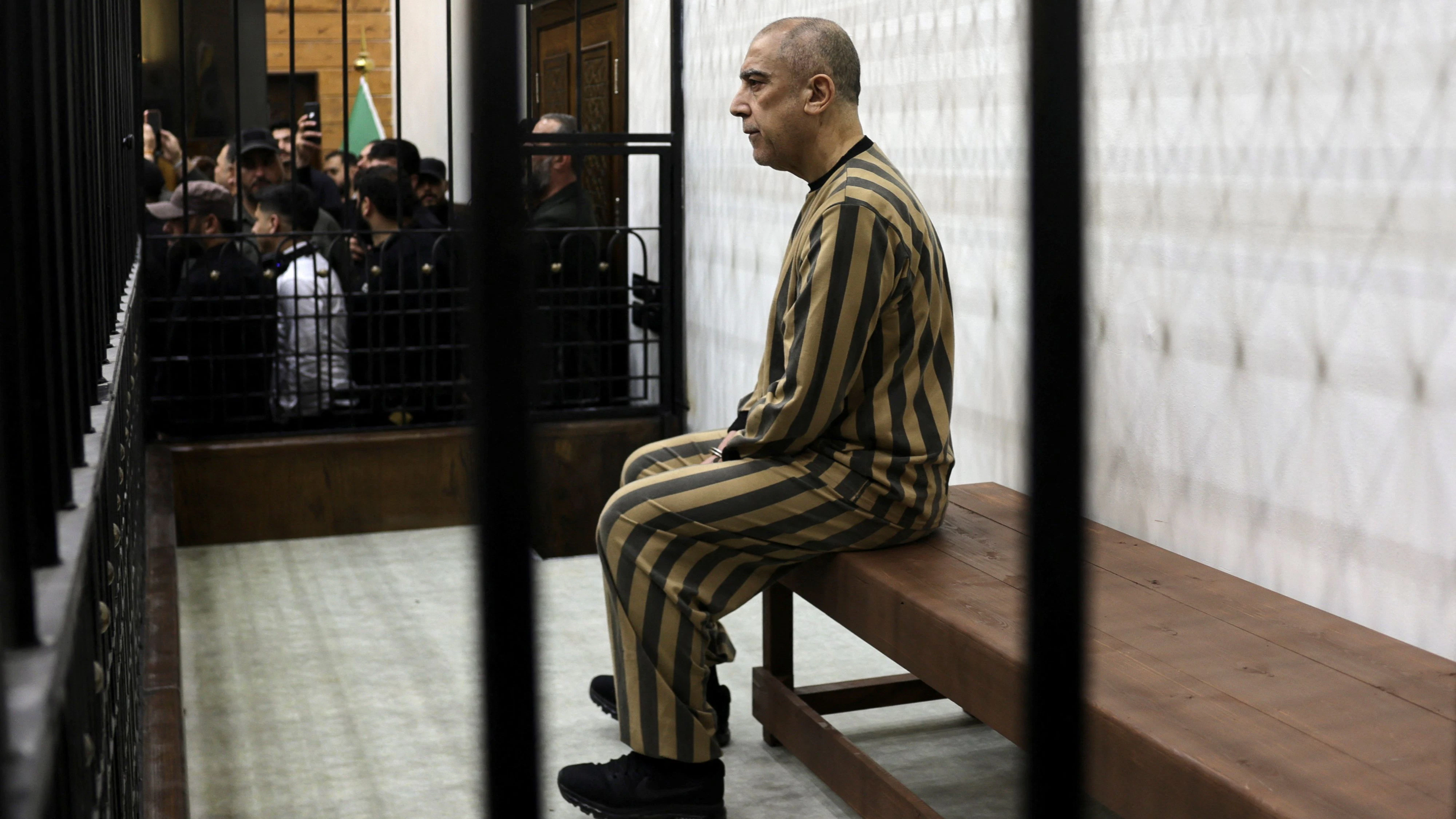 Atef Najib, a brigadier general and former head of the Political Security Department in Daraa during Syria's ousted President Bashar al-Assad's rule, who is accused of committing war crimes, attends a trial session at the Palace of Justice, in Damascus, Syria, April 26, 2026. REUTERS/Khalil Ashawi      TPX IMAGES OF THE DAY     