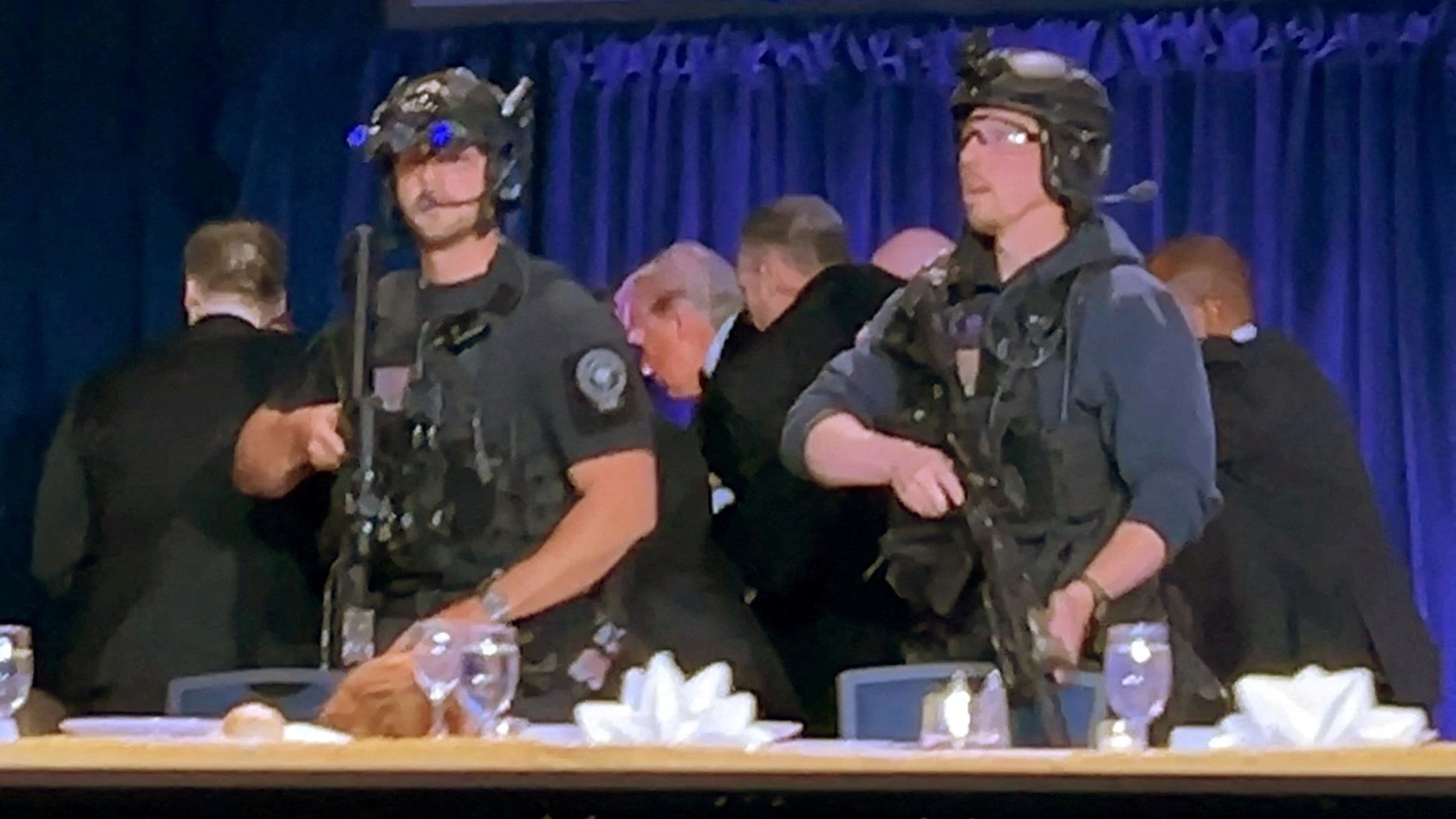 U.S. President Donald Trump is escorted out after a man opened fire with a shotgun on security personnel outside the room, during the annual White House Correspondents' Association dinner in Washington, D.C., U.S., April 25, 2026, in this still image from video. REUTERS/Bo Erickson THIS IMAGE WAS PROCESSED BY REUTERS TO ENHANCE QUALITY, AN UNPROCESSED VERSION HAS BEEN PROVIDED SEPARATELY.     TPX IMAGES OF THE DAY     