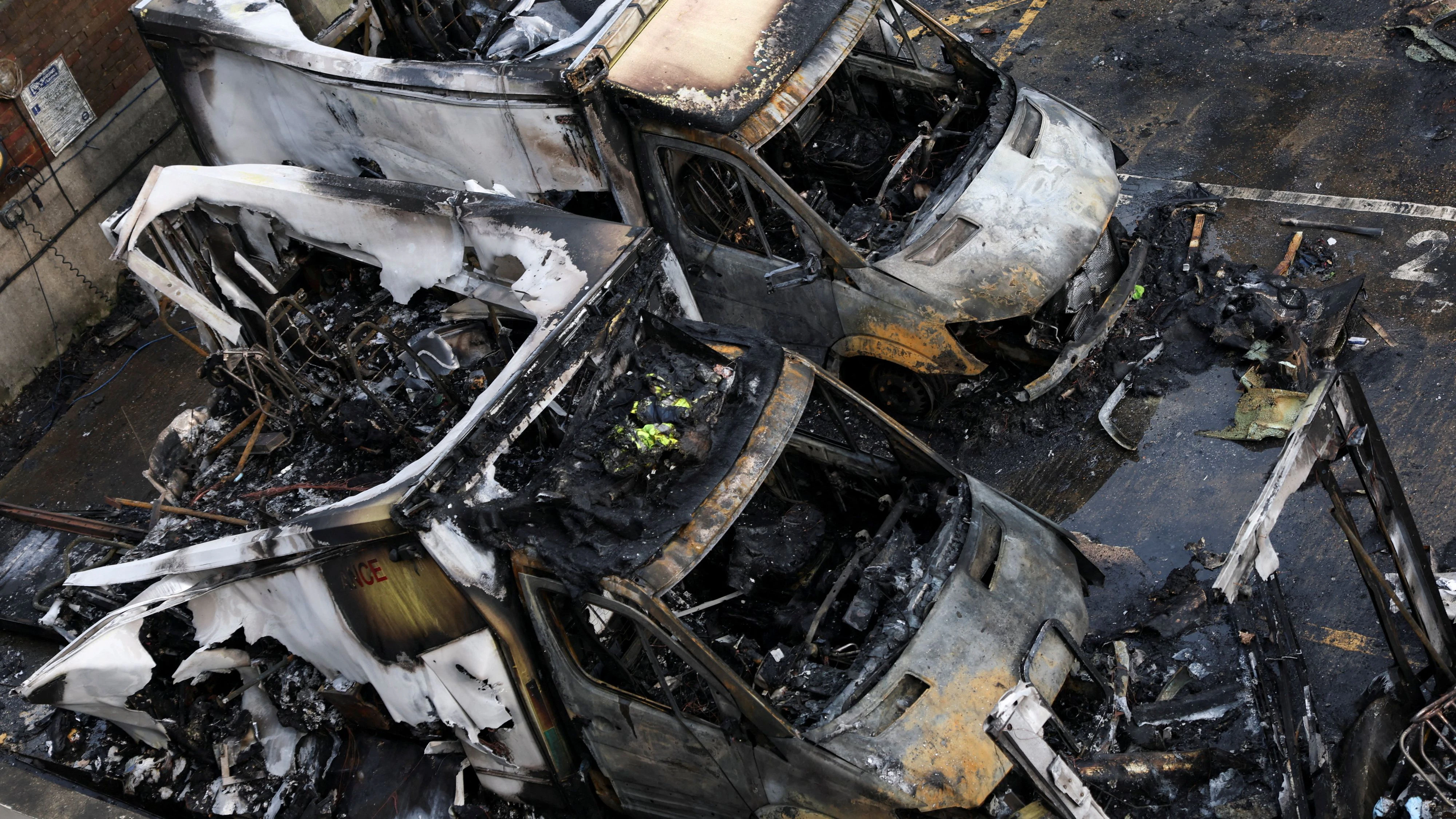 Charred remains of ambulances belonging to Hatzola, a Jewish community organisation, which were set on fire in an incident that the police say is being treated as an antisemitic hate crime, in northwest London, Britain, March 23, 2026. REUTERS/Hannah McKay      TPX IMAGES OF THE DAY     