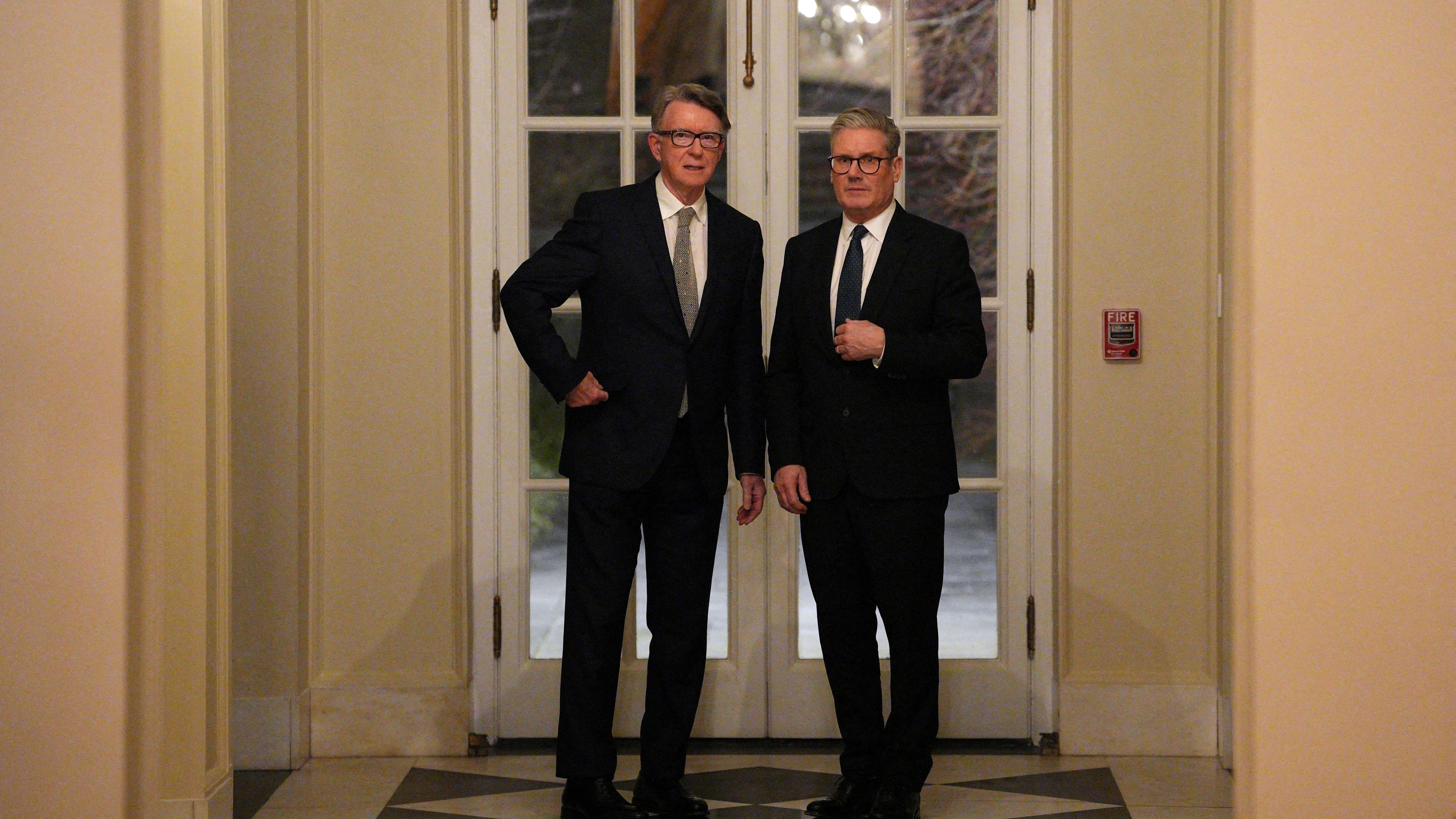 FILE PHOTO: British Prime Minister Keir Starmer talks with Britain's ambassador to the United States Peter Mandelson during a welcome reception at the ambassador's residence on February 26, 2025, in Washington, DC, U.S. Carl Court/Pool via REUTERS/File Photo