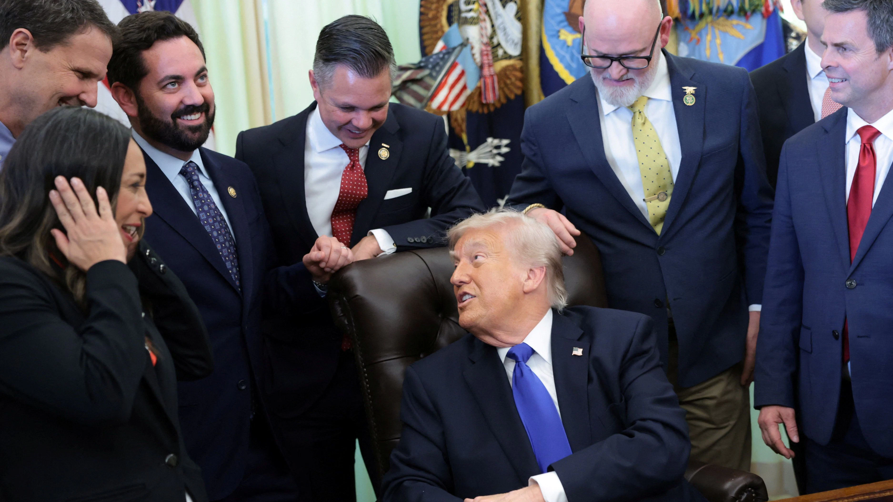 U.S. President Donald Trump speaks to Republican members of the House of Representatives after signing executive orders with them around his desk in the Oval Office at the White House in Washington, D.C., U.S., April 30, 2026. REUTERS/Jonathan Ernst