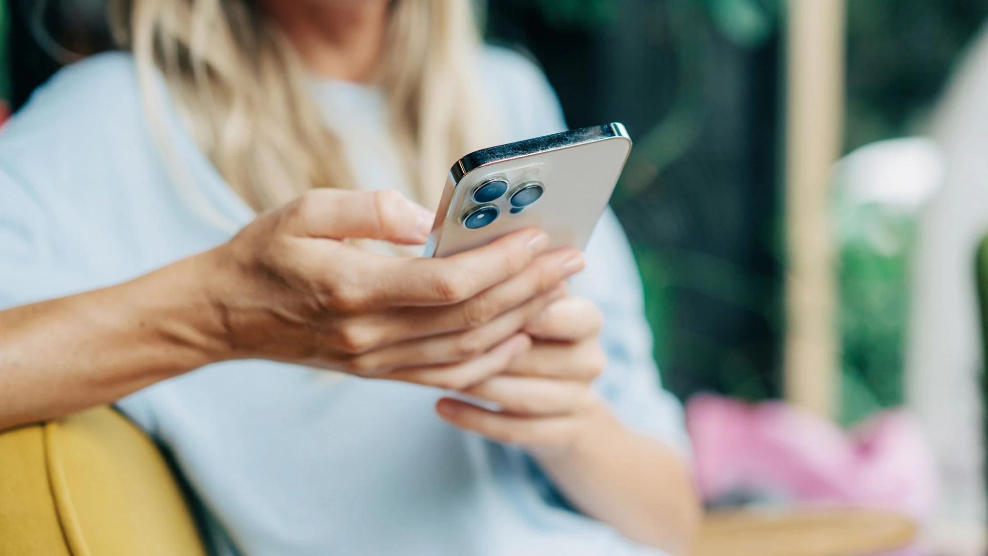 Close-up of a mobile phone in the hands of an unrecognizable person.