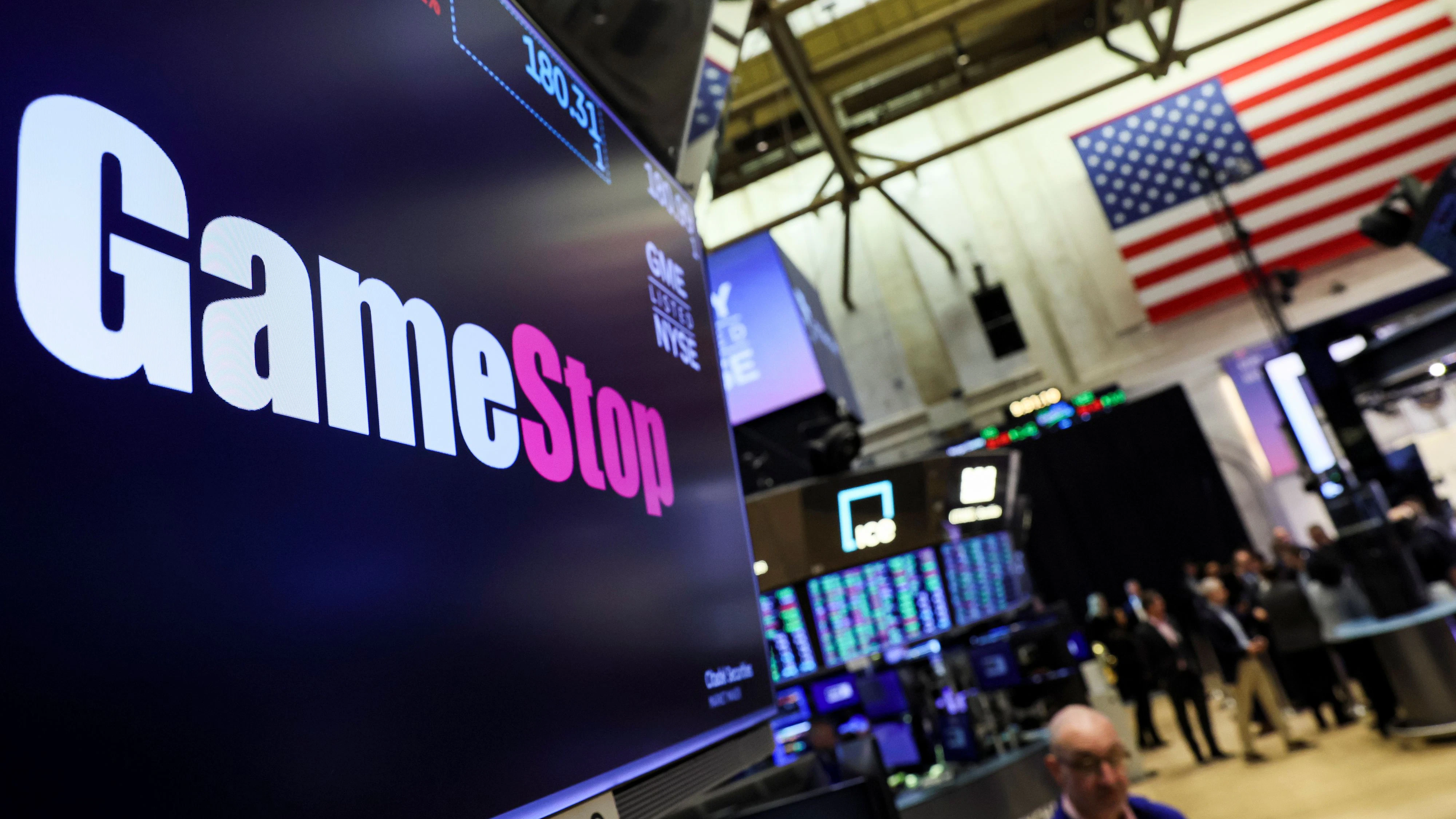 A screen displays the logo and trading information for GameStop on the floor of the New York Stock Exchange (NYSE) in New York City, U.S., March 29, 2022.  REUTERS/Brendan McDermid 