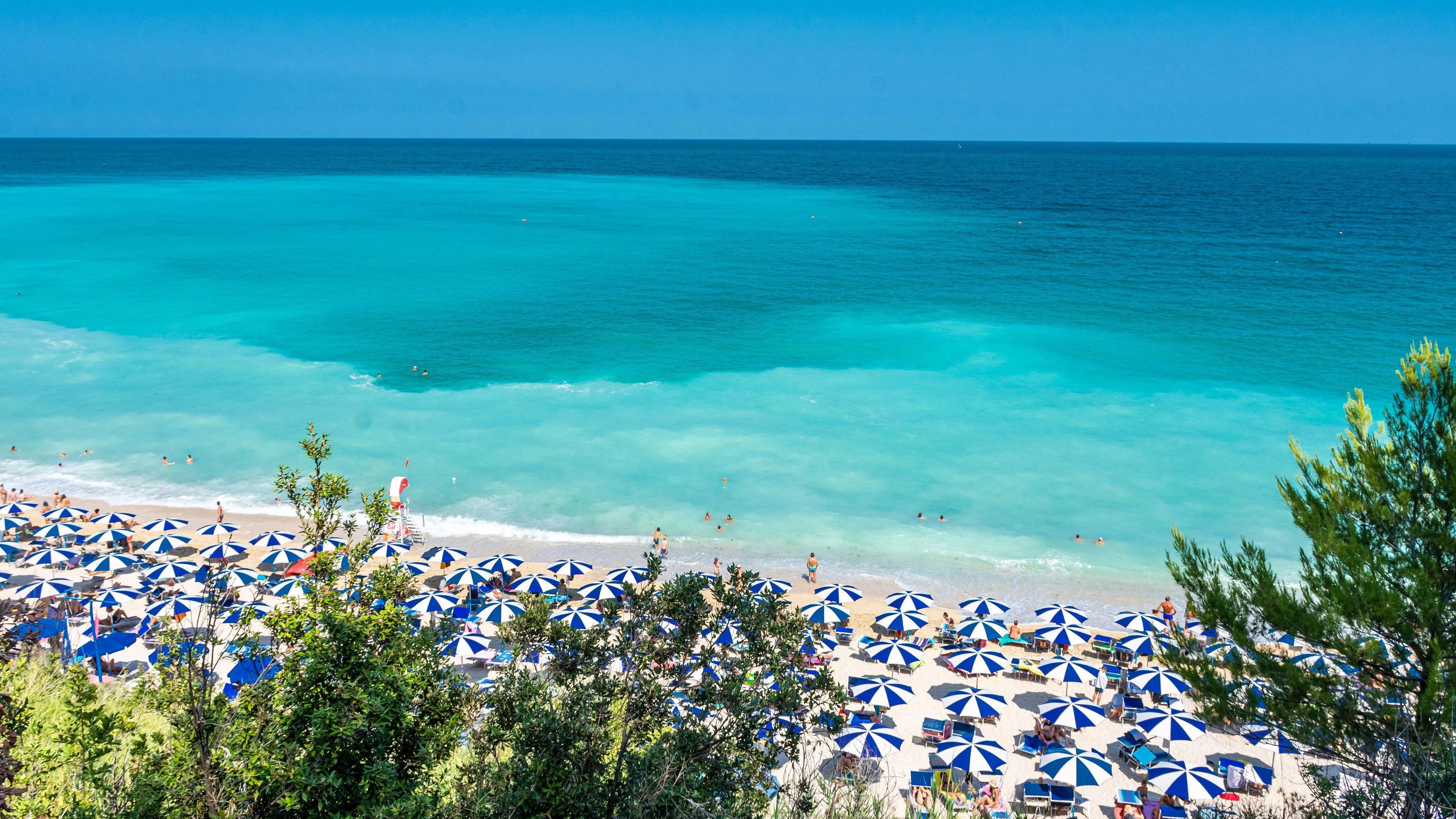 SIROLO, ITALY, 23 JULY 2021: The beautiful Sassi Neri Beach down the Conero Mount in the Marche Region