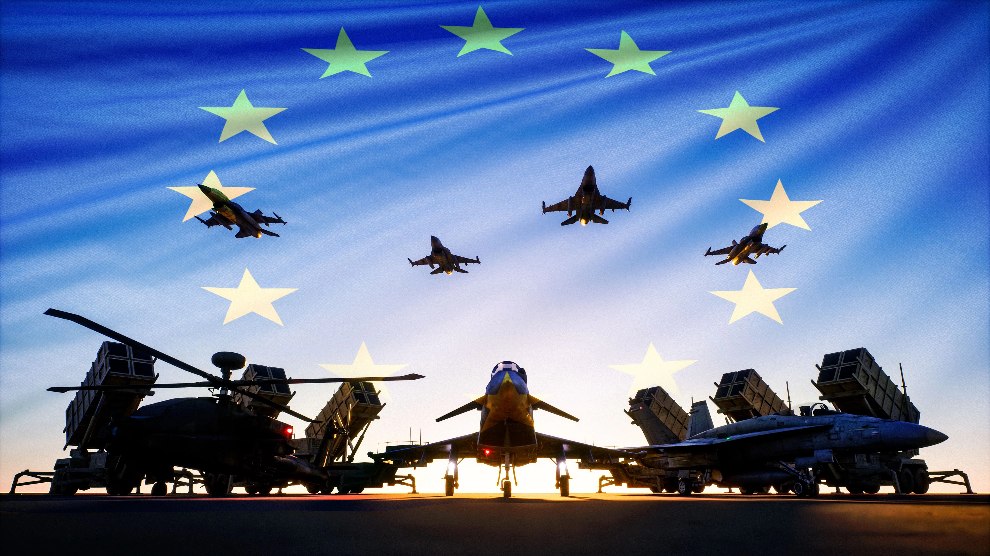 This image conveys a powerful symbol of European military strength and unity. Silhouetted against a vivid sunrise, modern American fighter jets, missile systems, and helicopters stand ready beneath the European Union flag, suggesting a coordinated European defense or rearmament effort. The composition reflects themes of military readiness, collective security, and strategic defense cooperation.