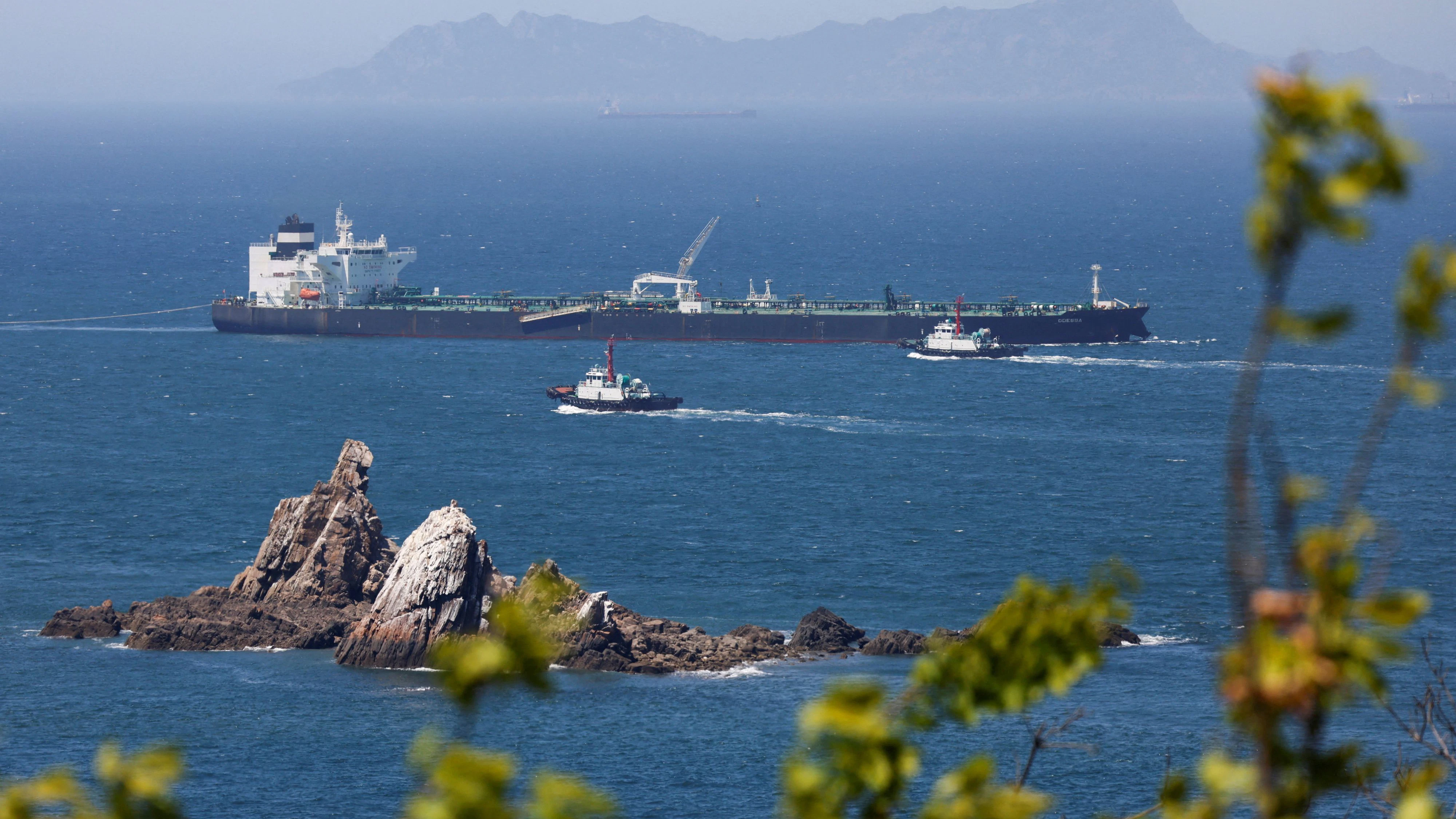 Tugboats guide the crude oil tanker Odessa, carrying UAE crude after passing through the Strait of Hormuz with its Automatic Identification System transponder turned off, navigates the waters at Daesan port, where it is expected to discharge crude oil, in Seosan, South Korea, May 8, 2026. REUTERS/Kim Soo-hyeon     TPX IMAGES OF THE DAY     