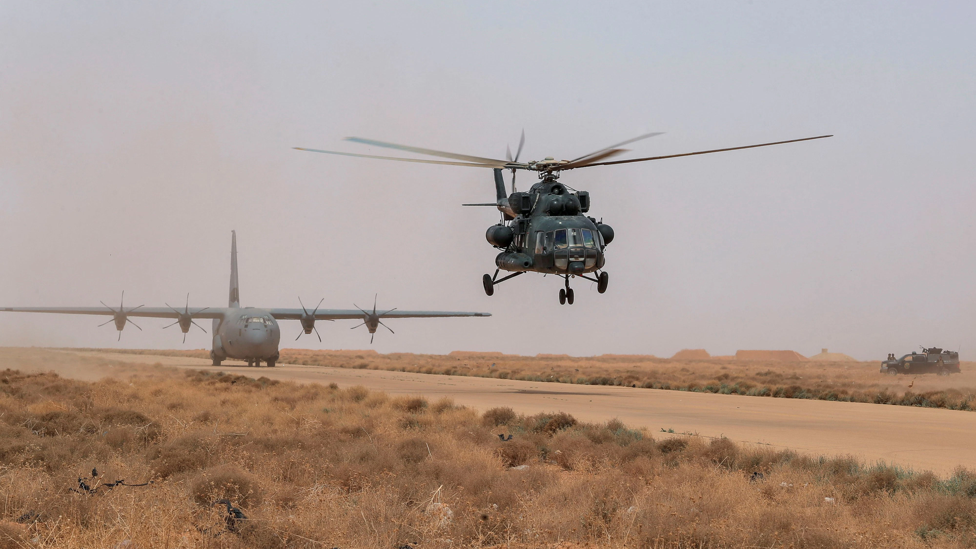 An Iraqi Army helicopter flies during the "Solid Will" military operation against Islamic State militants in the desert of Anbar, Iraq April 23, 2022. REUTERS/Thaier Al-Sudani