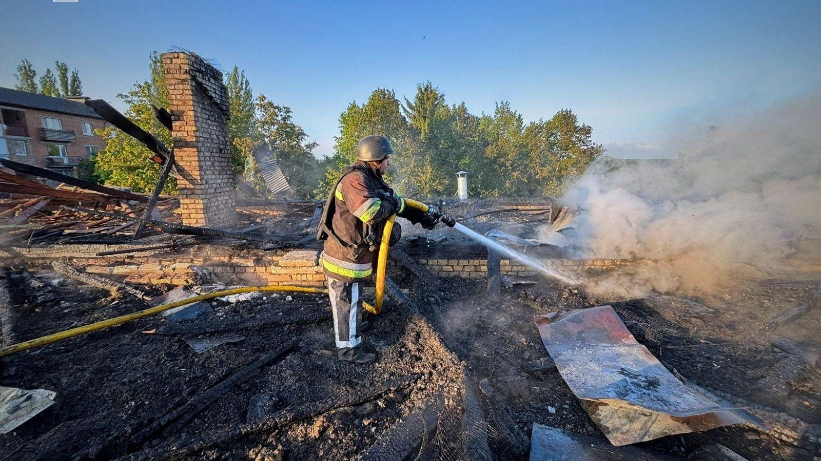 A firefighter works at the site of a kindergarten damaged during a Russian drone strike, amid Russia's attack on Ukraine, in Kyiv region, Ukraine May 12, 2026. Press service of the State Emergency Service of Ukraine in Kyiv region/Handout via REUTERS ATTENTION EDITORS - THIS IMAGE HAS BEEN SUPPLIED BY A THIRD PARTY. WATERMARK FROM SOURCE. MANDATORY CREDIT. BEST QUALITY AVAILABLE. 