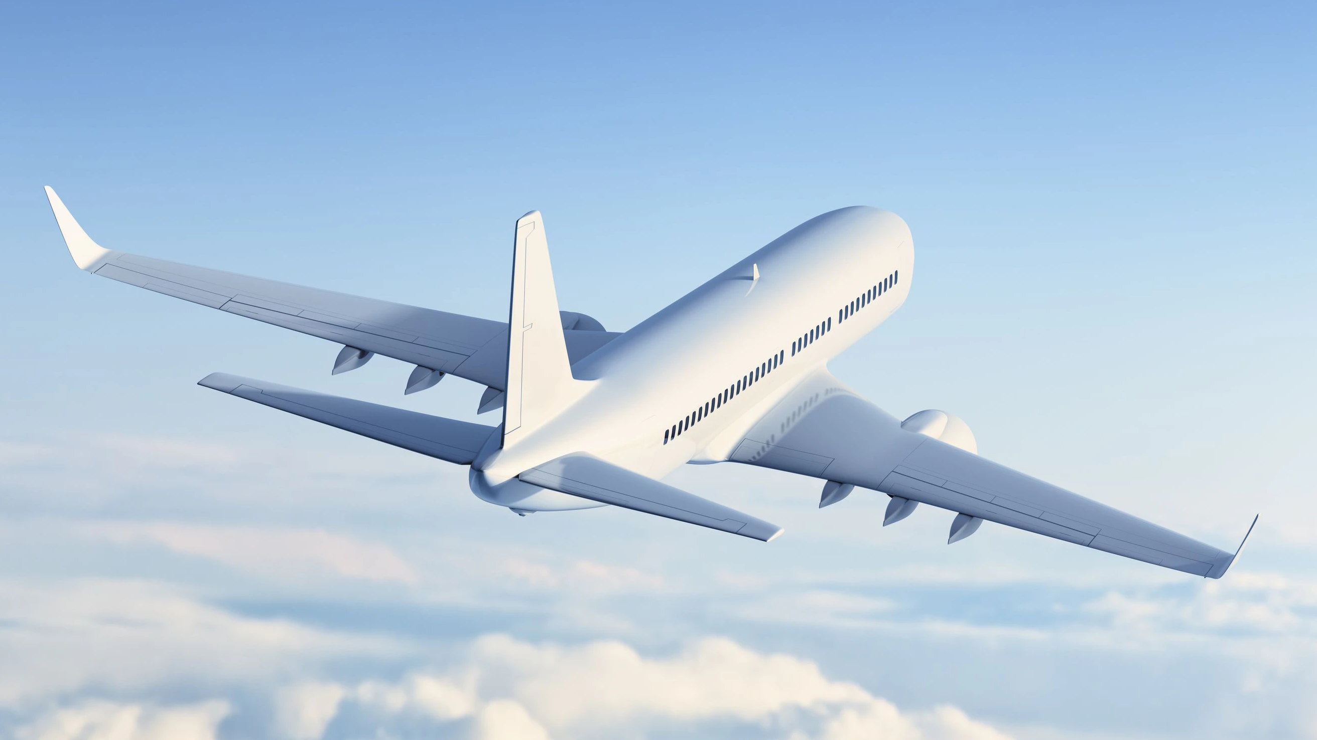 Commercial jet flying above clouds.