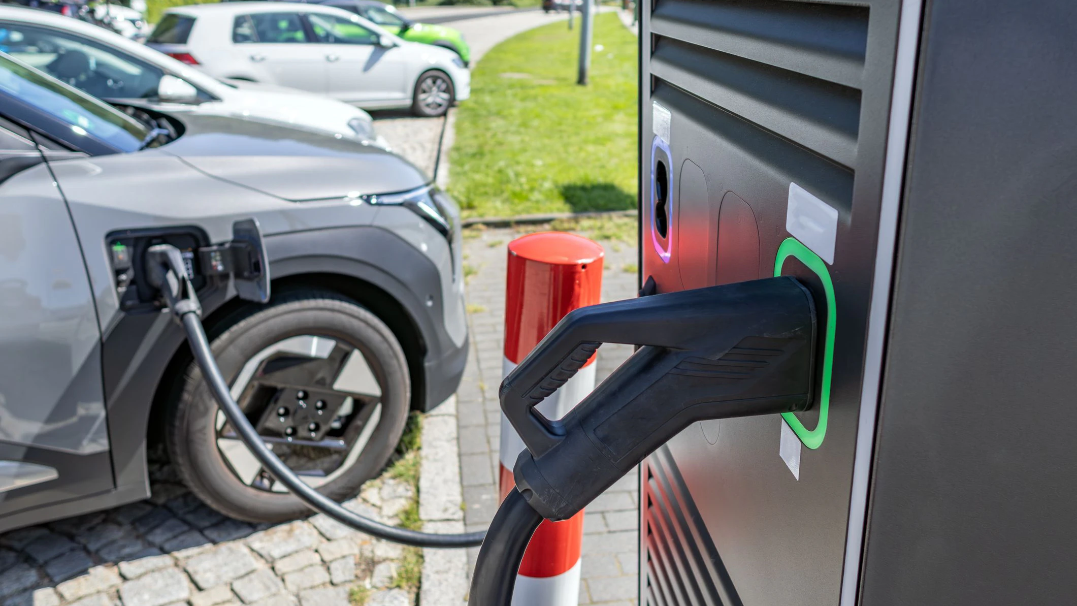 electric car is charged at the motorway service station