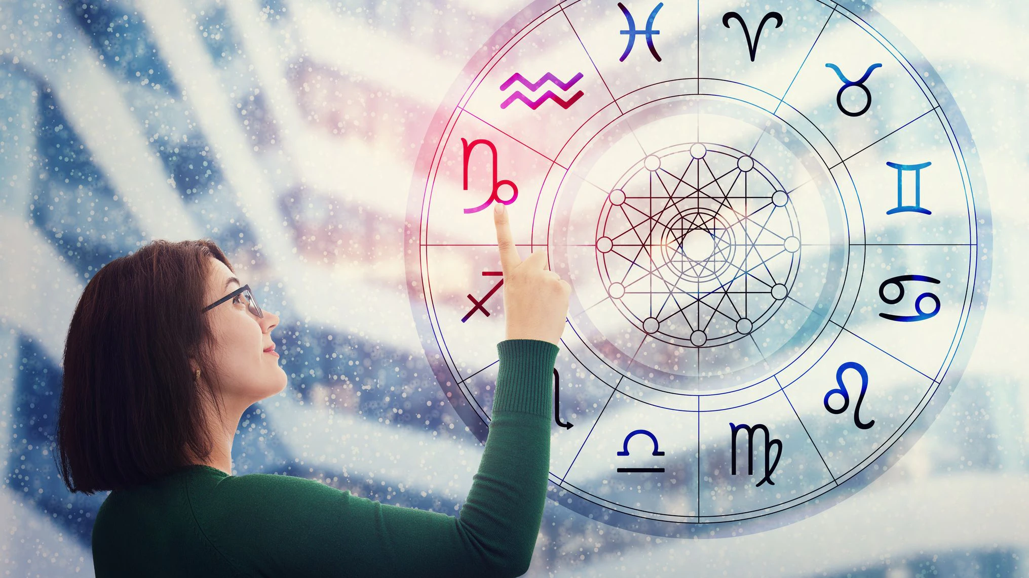 Woman choosing a zodiac sign from the astrological wheel to find the future predictions. Having trust in horoscope, consulting stars and believe in the power of universe. Astrology esoteric concept.